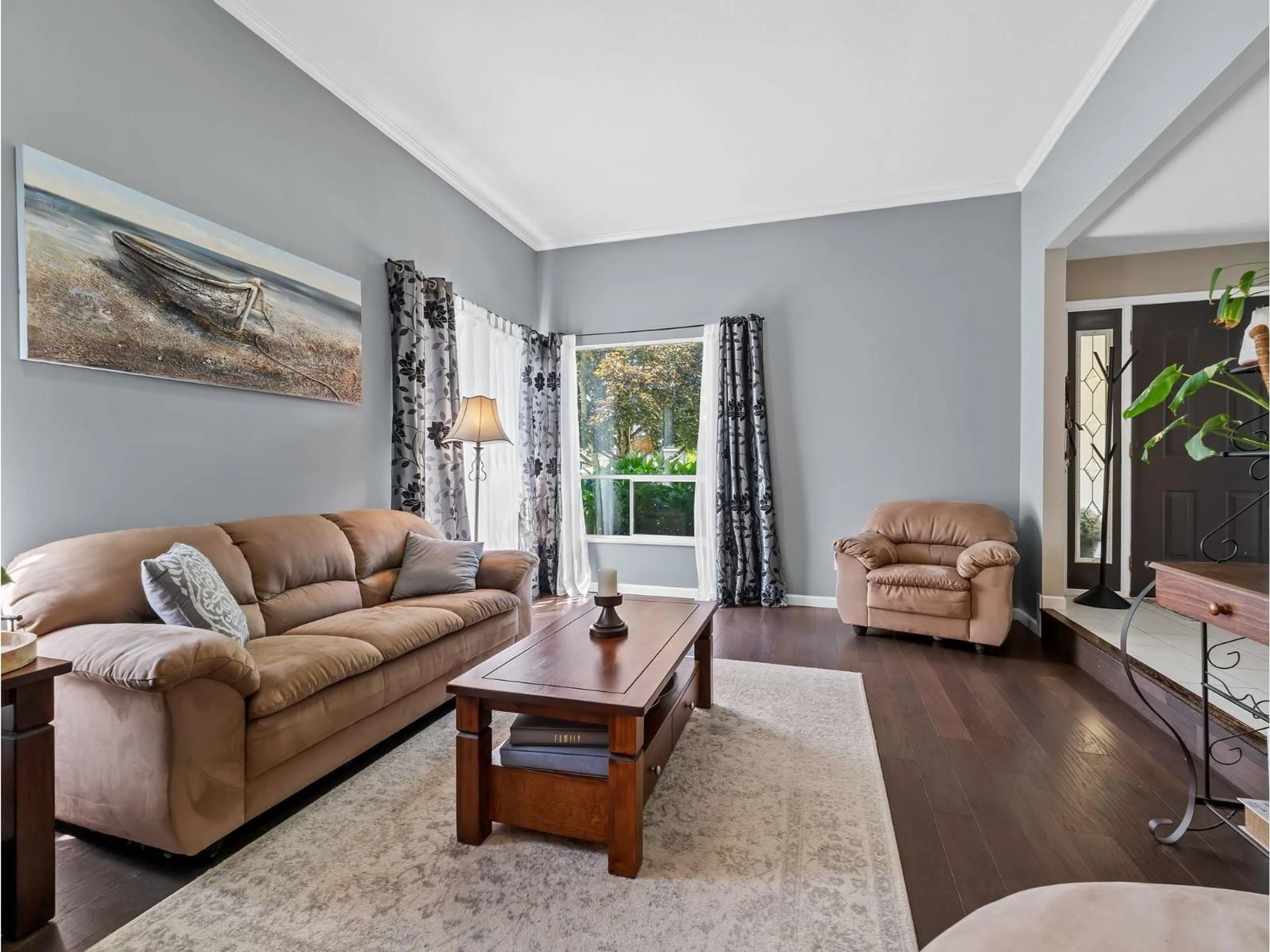 Living room with furniture, wood/laminate floor for 8672 163 STREET, Surrey British Columbia V4N1C7
