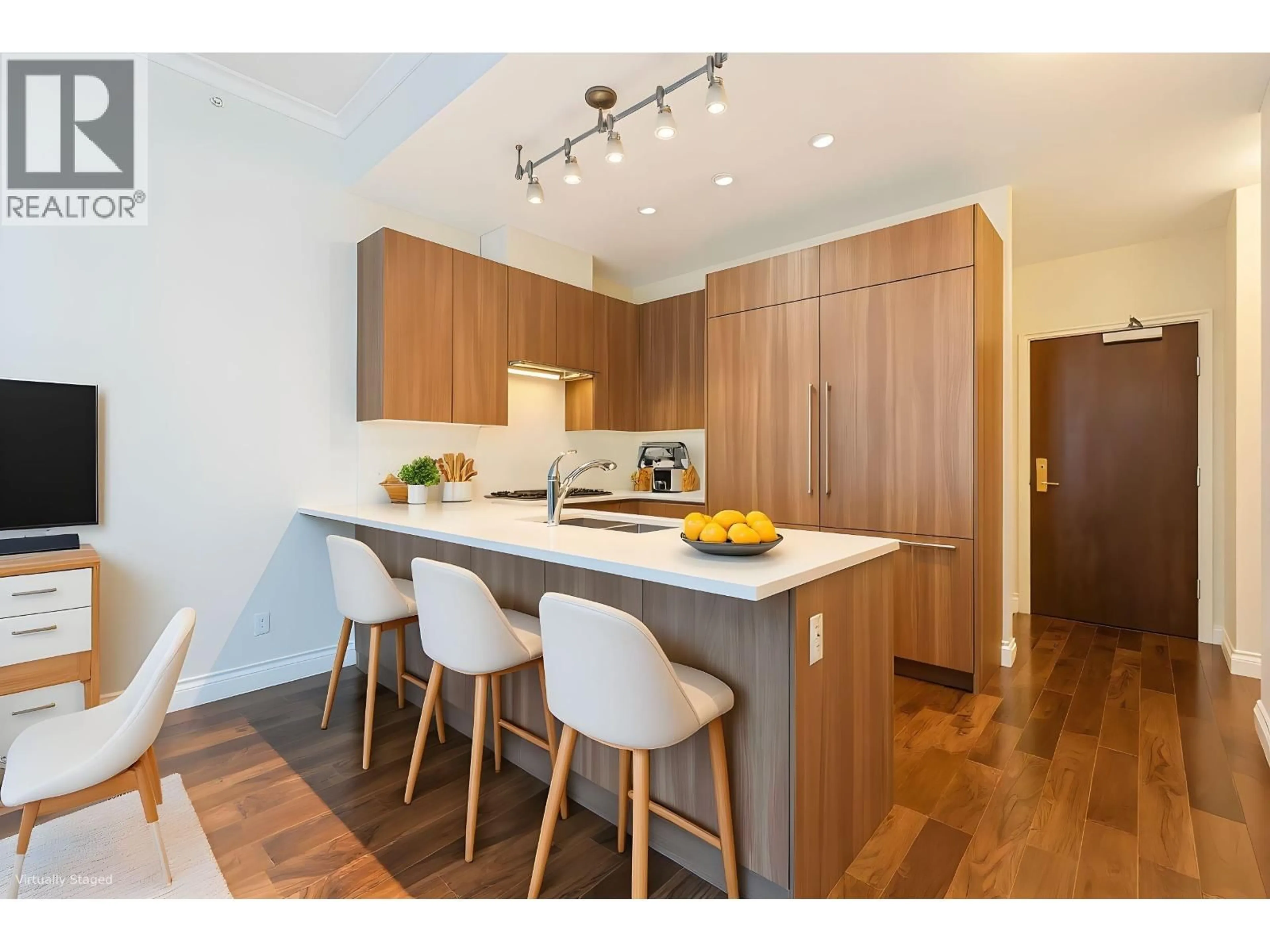 Open concept kitchen, wood/laminate floor for 103 - 185 VICTORY SHIP WAY, North Vancouver British Columbia V7L0G2