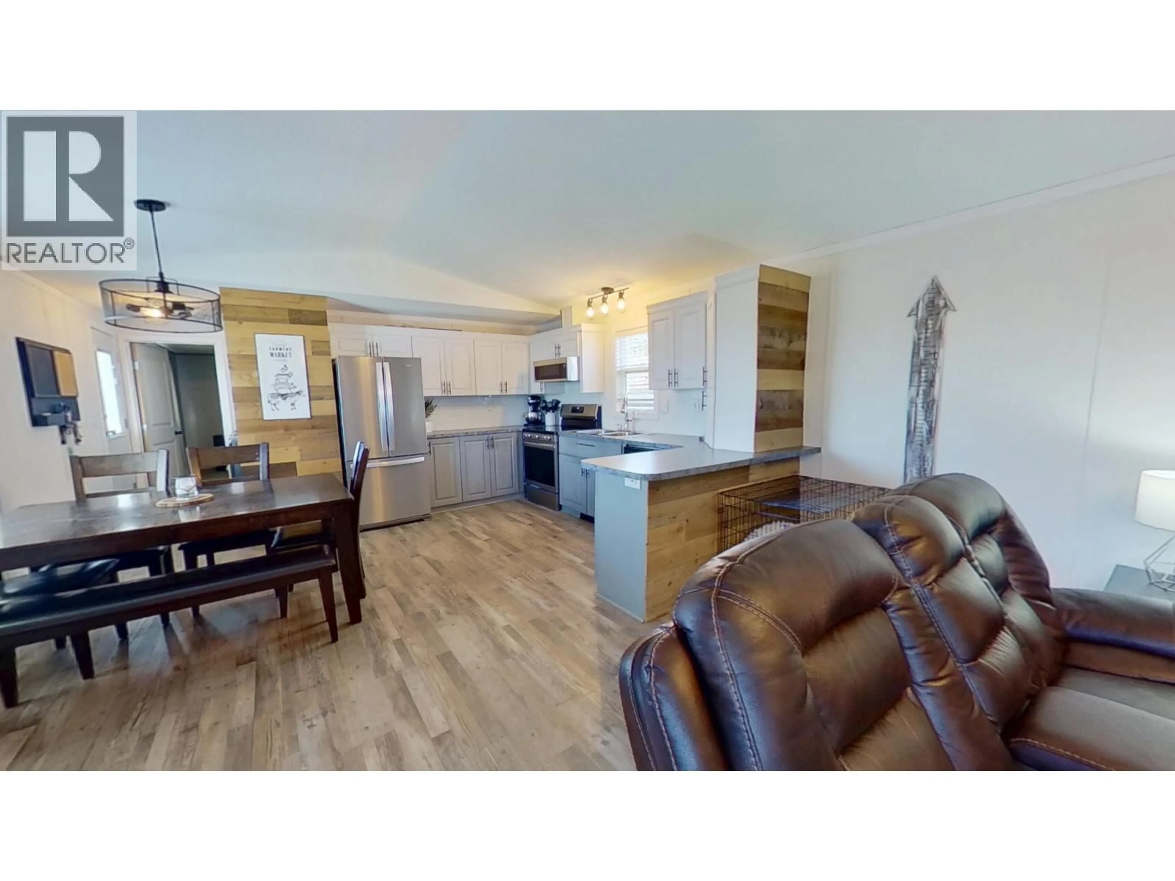Open concept kitchen, wood/laminate floor for 10074 99 STREET, Taylor British Columbia V0C2K0