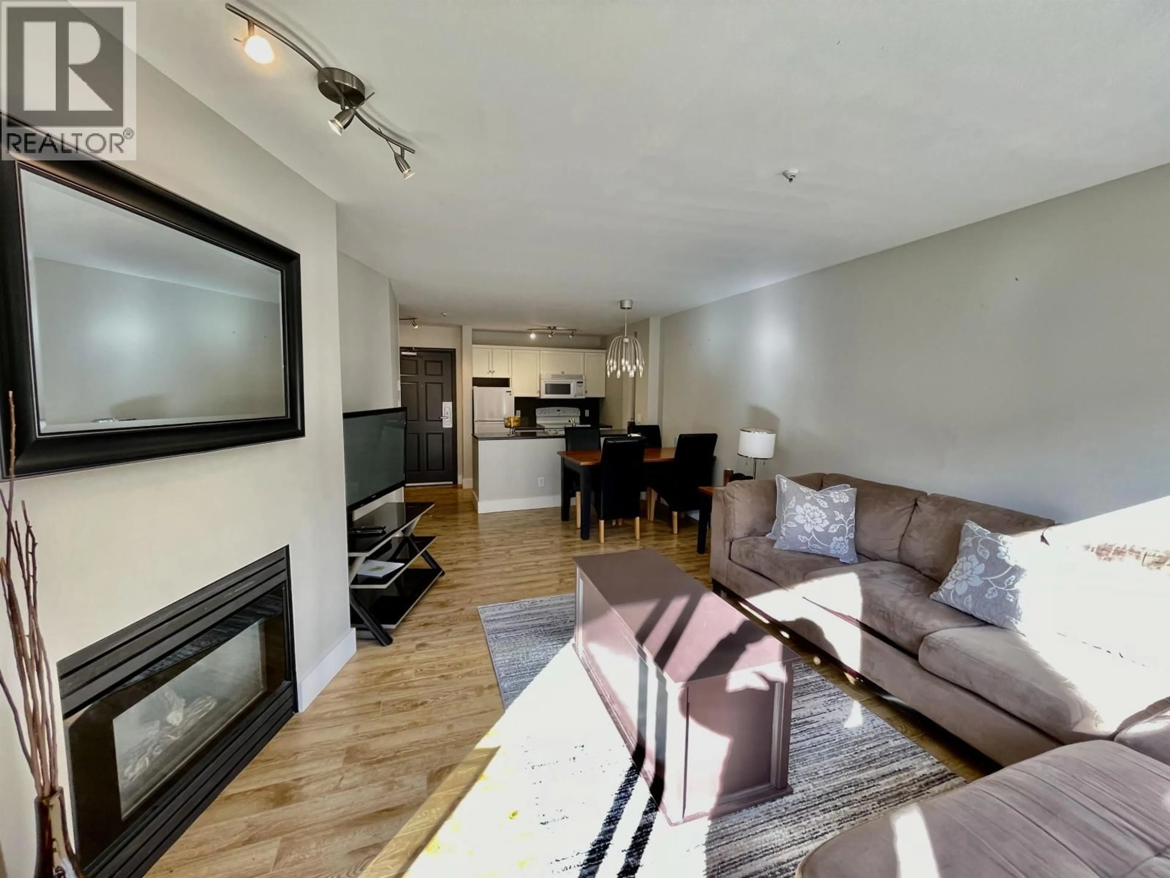 Living room with furniture, wood/laminate floor for 103 - 4800 SPEARHEAD DRIVE, Whistler British Columbia V8E1G1