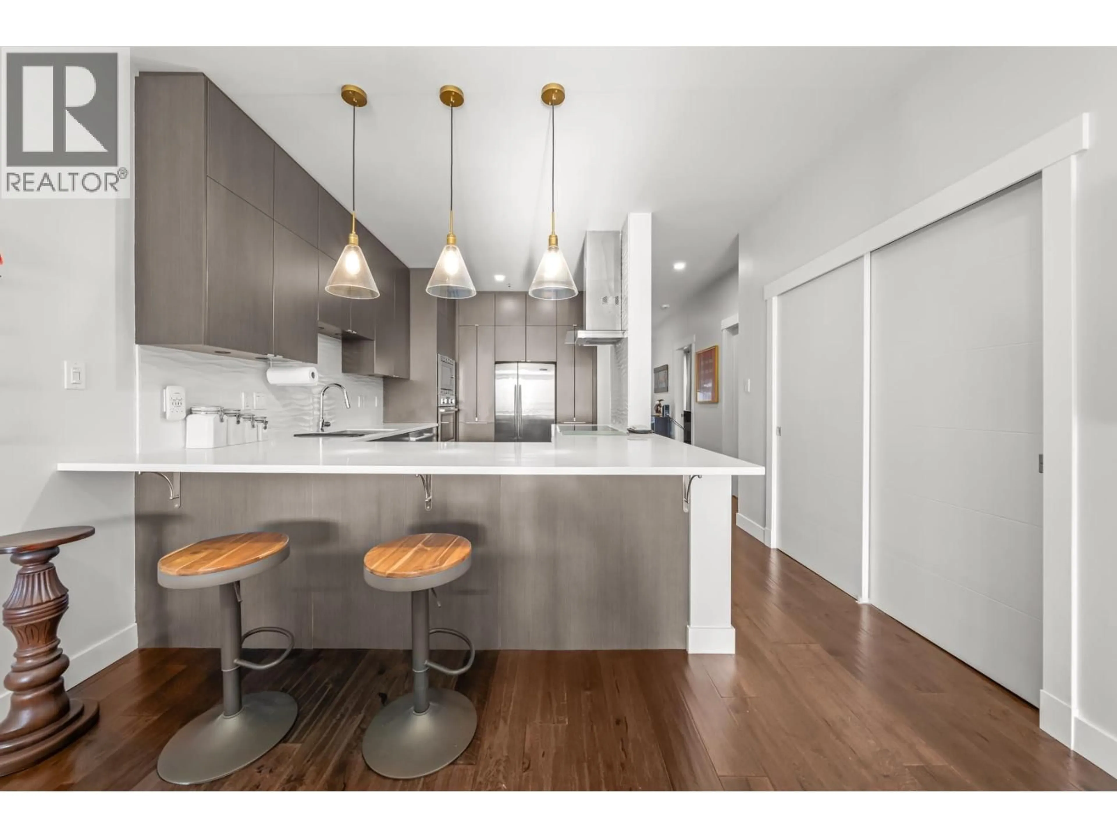 Open concept kitchen, wood/laminate floor for 204 - 2 RENAISSANCE SQUARE, New Westminster British Columbia V3M6K3