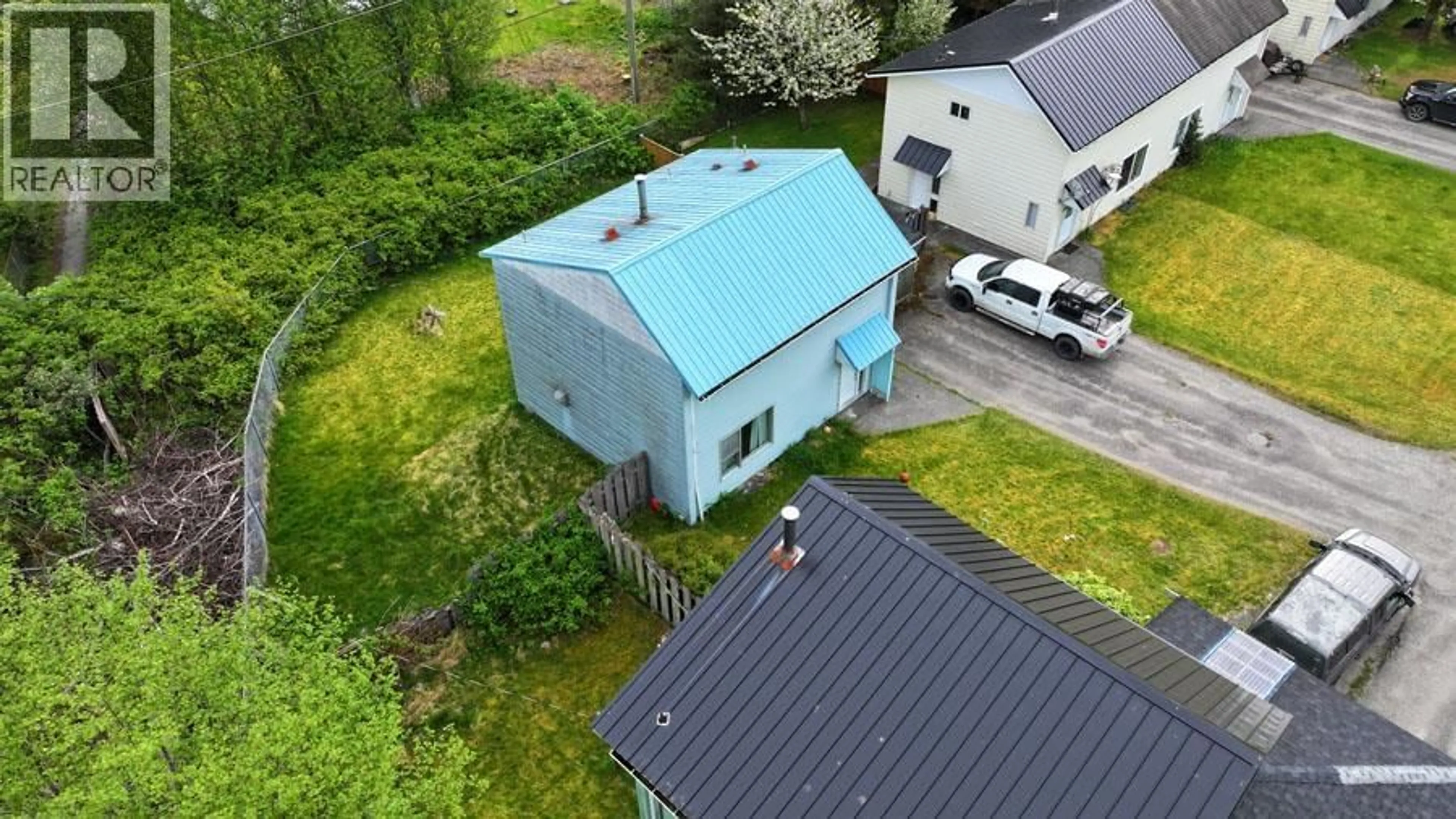 A pic from outside/outdoor area/front of a property/back of a property/a pic from drone, building for 1819 CEDAR CRESCENT, Masset British Columbia V0T1M0