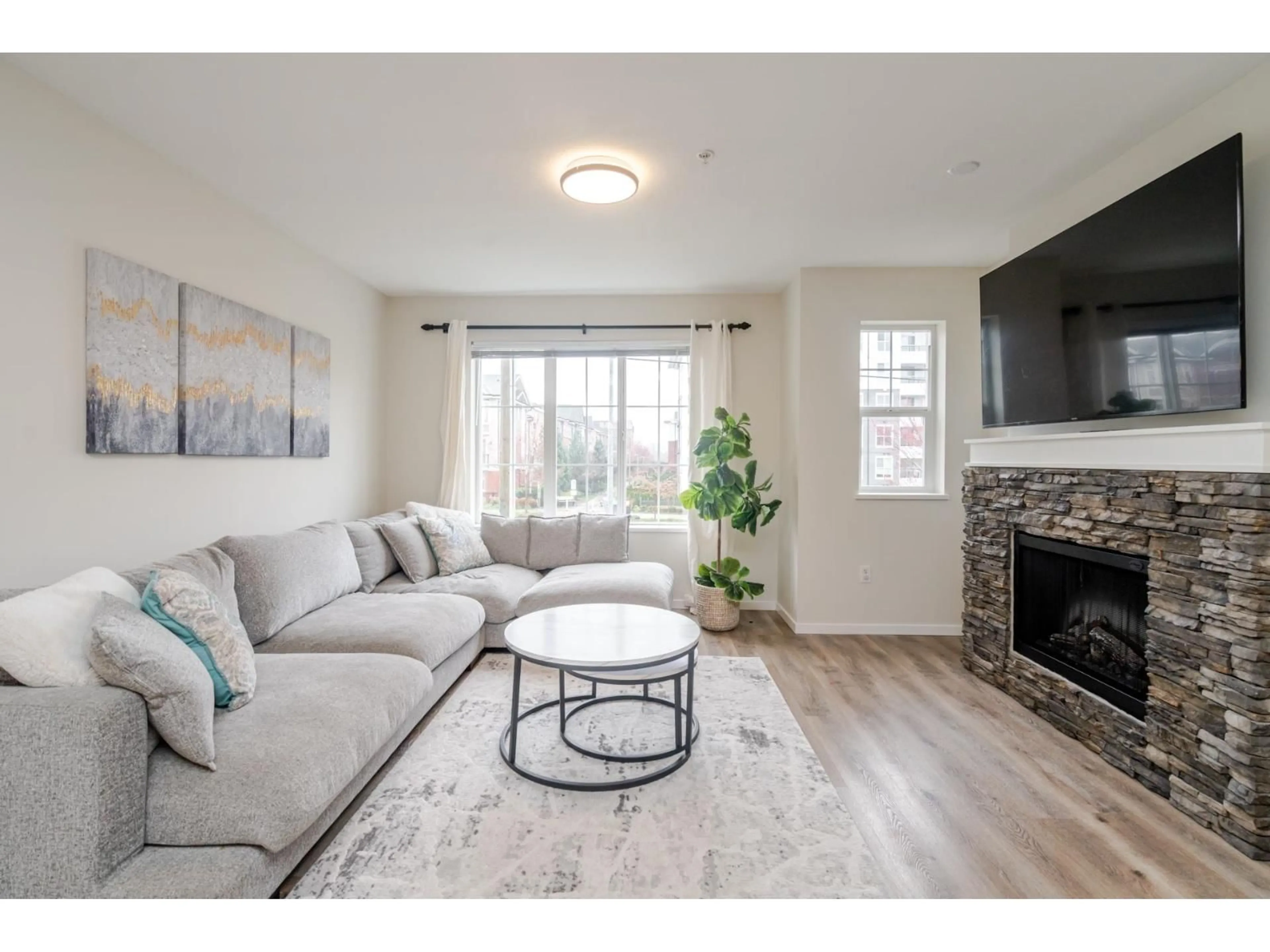 Living room with furniture, wood/laminate floor for 131 - 20875 80 AVENUE, Langley British Columbia V2Y0B2