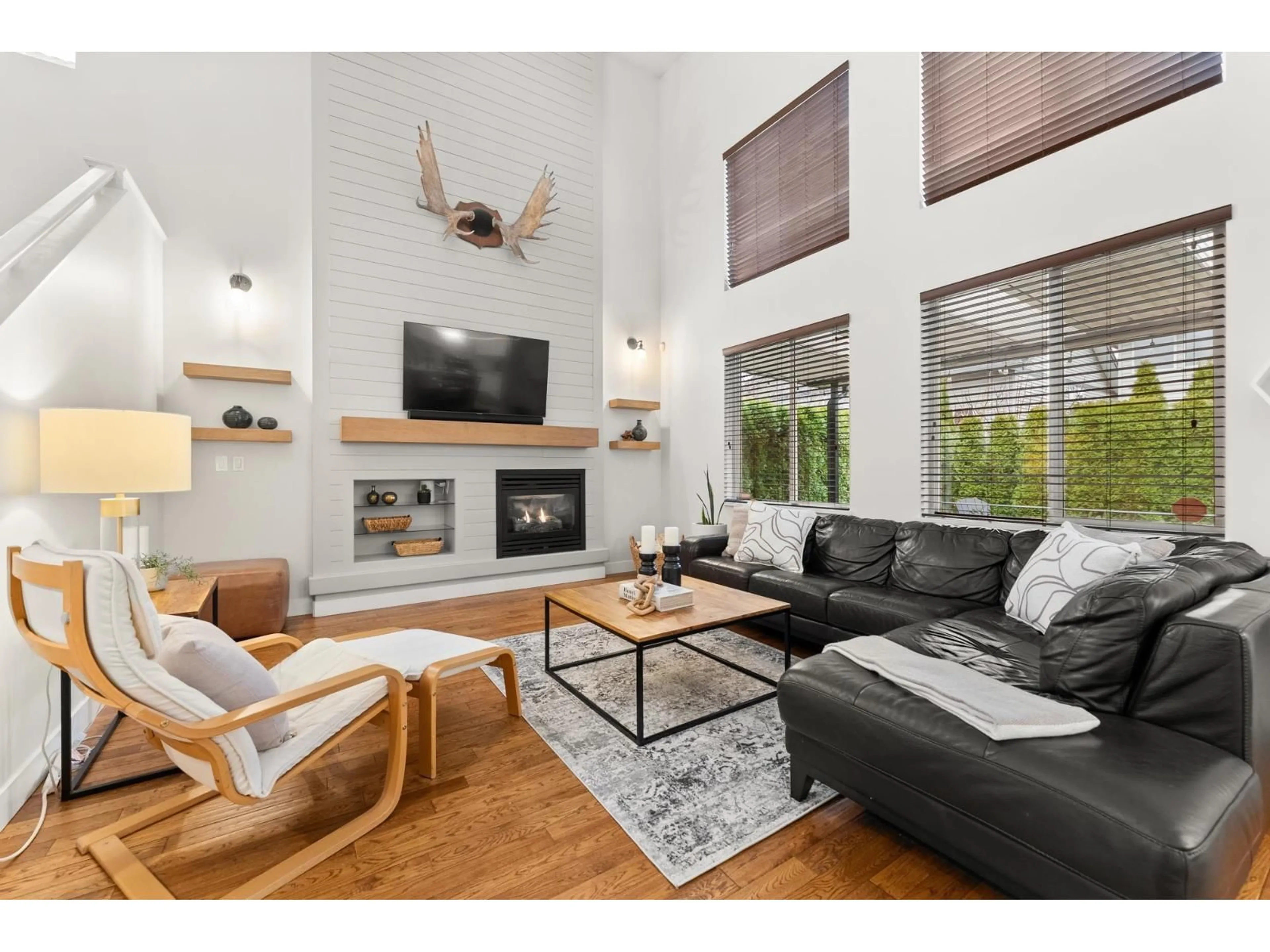 Living room with furniture, wood/laminate floor for 14918 59 AVENUE, Surrey British Columbia V3S3W8