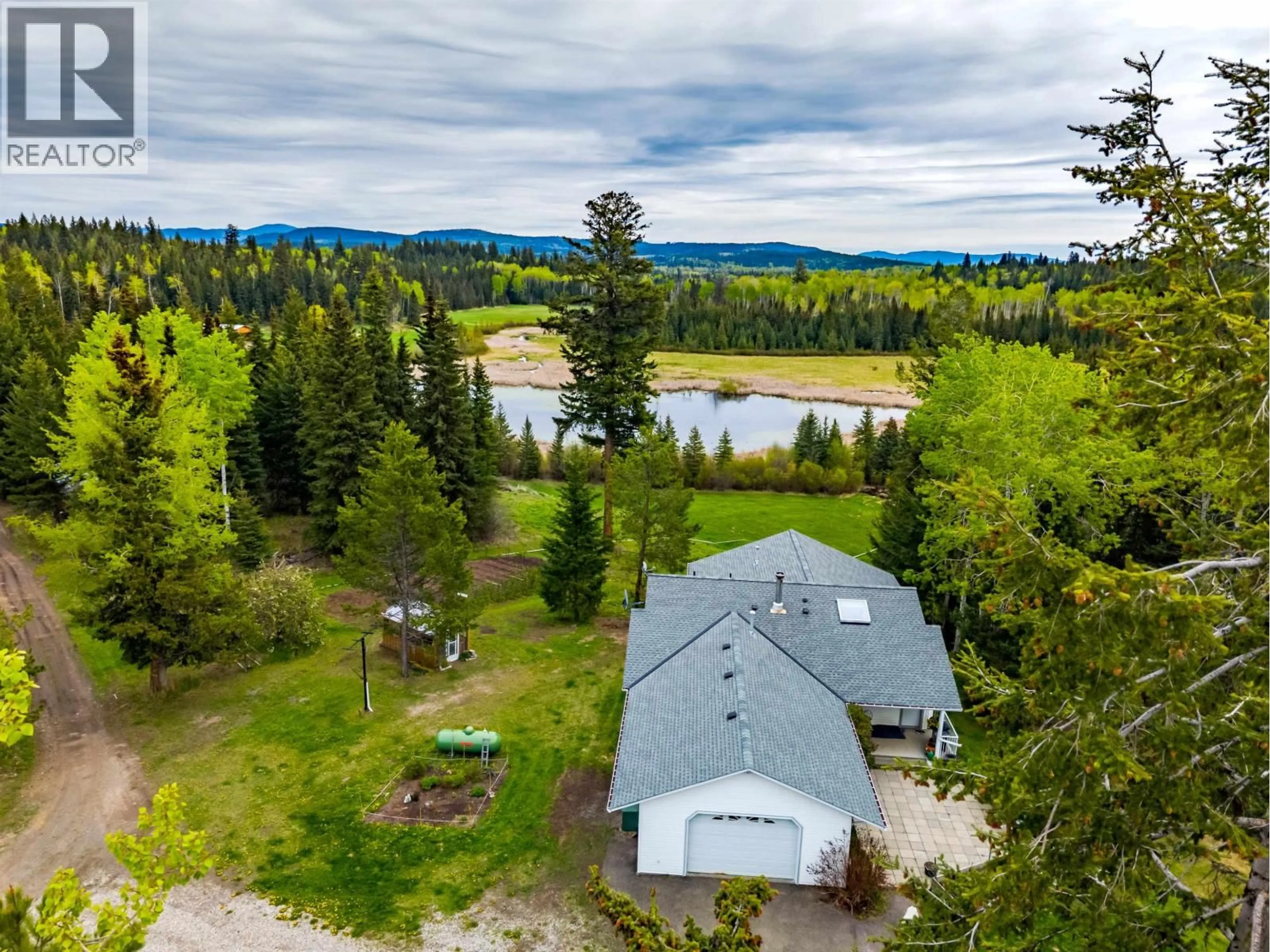 A pic from outside/outdoor area/front of a property/back of a property/a pic from drone, water/lake/river/ocean view for 7497 LITTLE FORT 24 HIGHWAY, Bridge Lake British Columbia V0K1X2