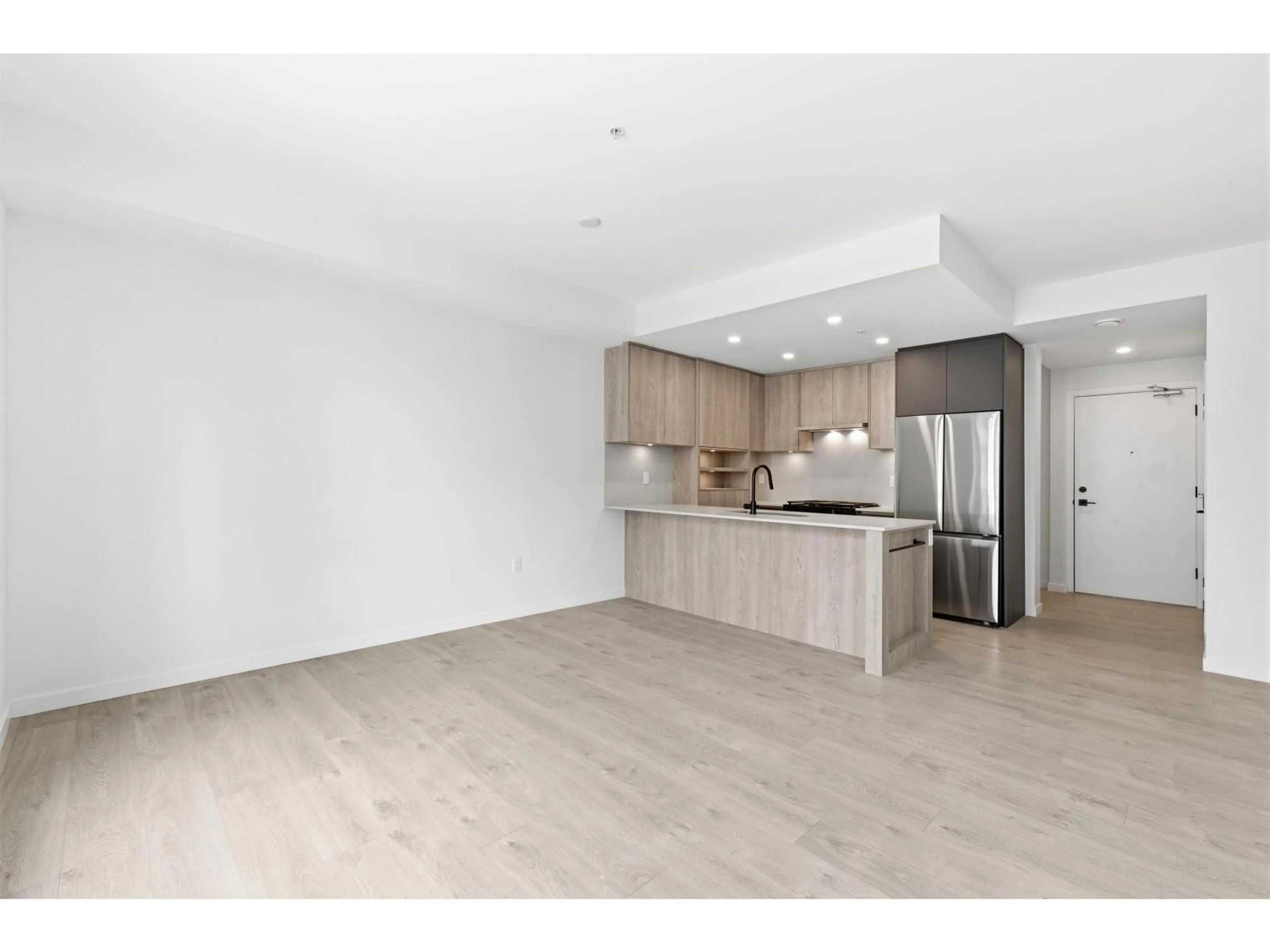 Open concept kitchen, wood/laminate floor for 512 - 19577 65B AVENUE, Surrey British Columbia V4N6Y3