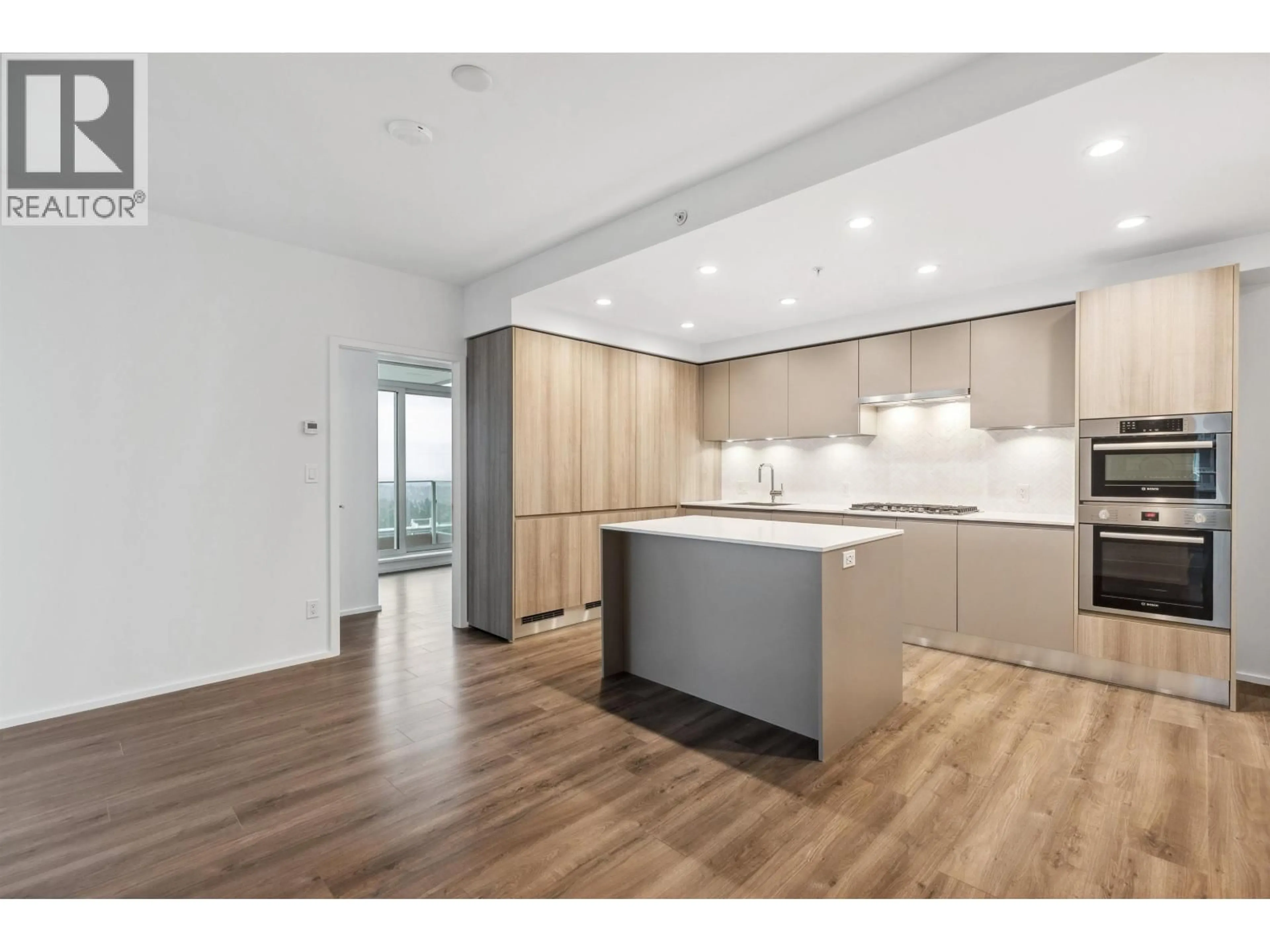 Open concept kitchen, wood/laminate floor for 4505 - 3833 EVERGREEN PLACE, Burnaby British Columbia V3J0M2