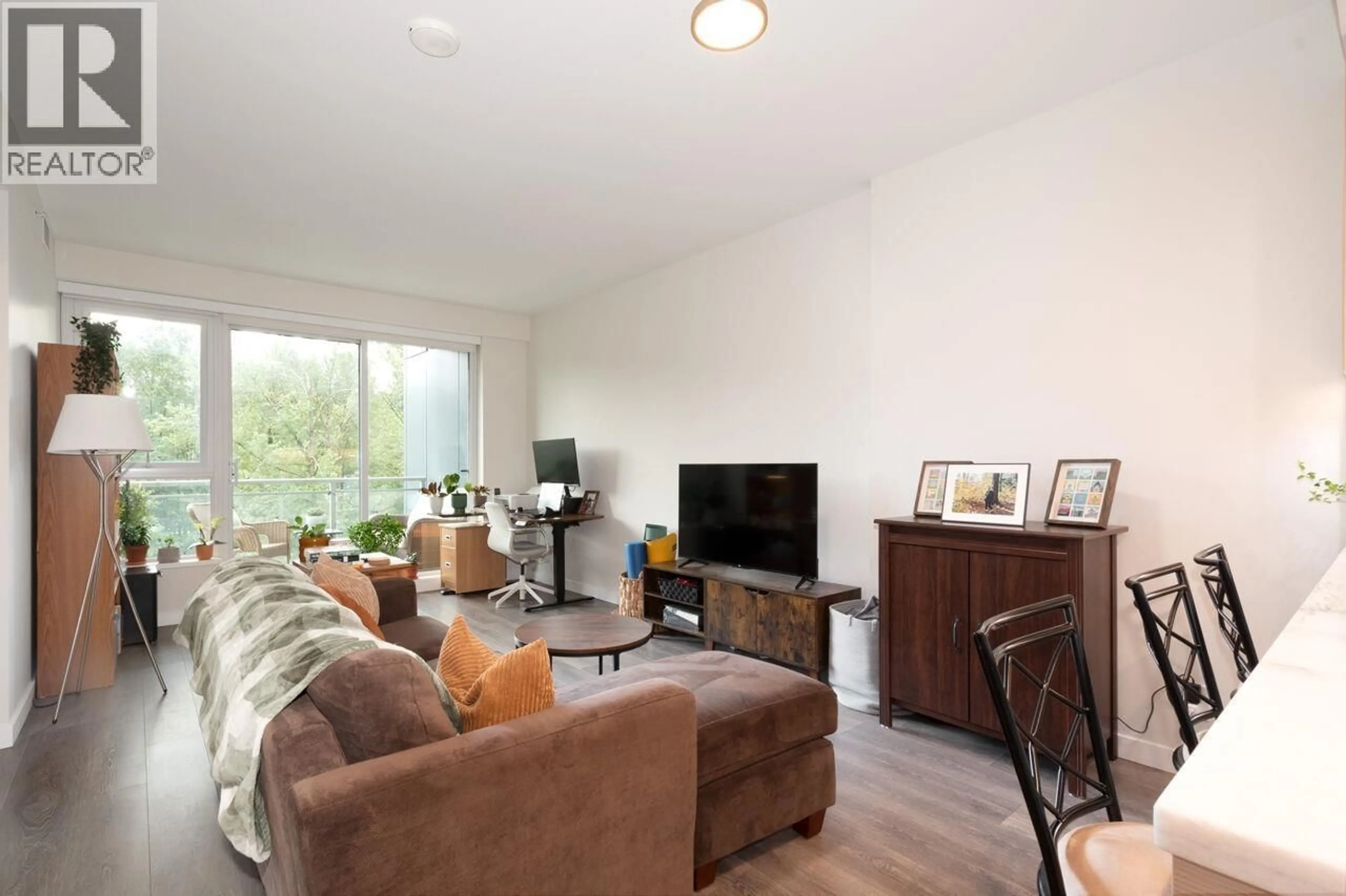 Living room with furniture, wood/laminate floor for 905 - 308 MORRISSEY ROAD, Port Moody British Columbia V3H0M2