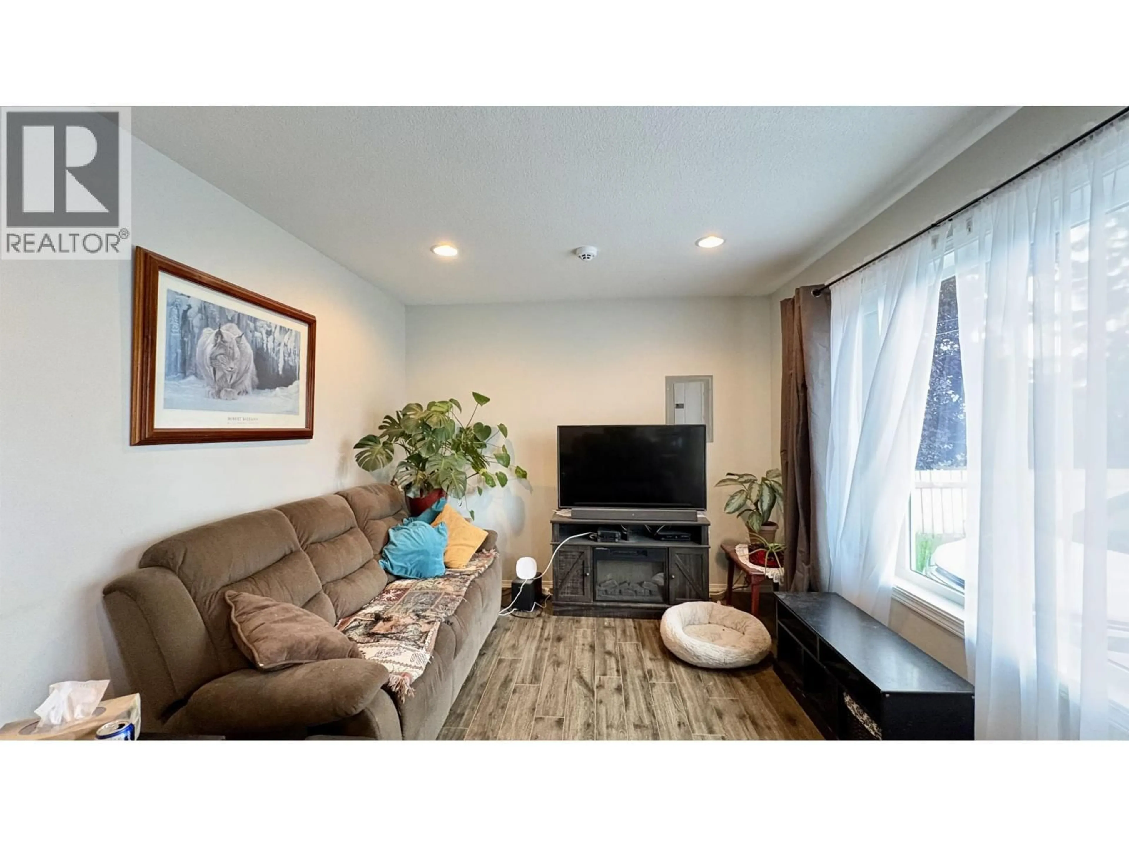 Living room with furniture, wood/laminate floor for 2205 REDWOOD STREET, Prince George British Columbia V2L2N5