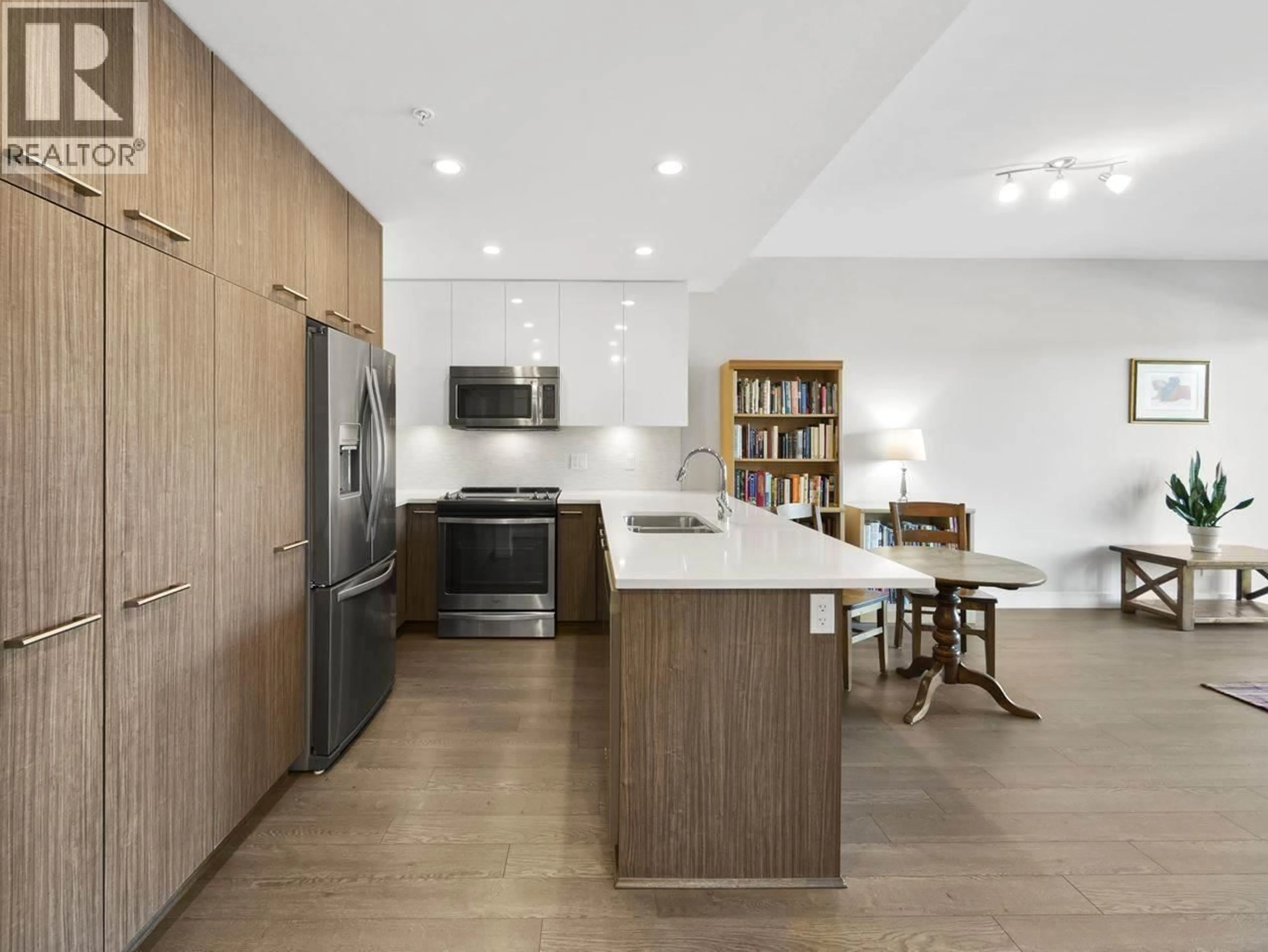 Open concept kitchen, wood/laminate floor for 205 - 875 GIBSONS WAY, Gibsons British Columbia V0N1V7