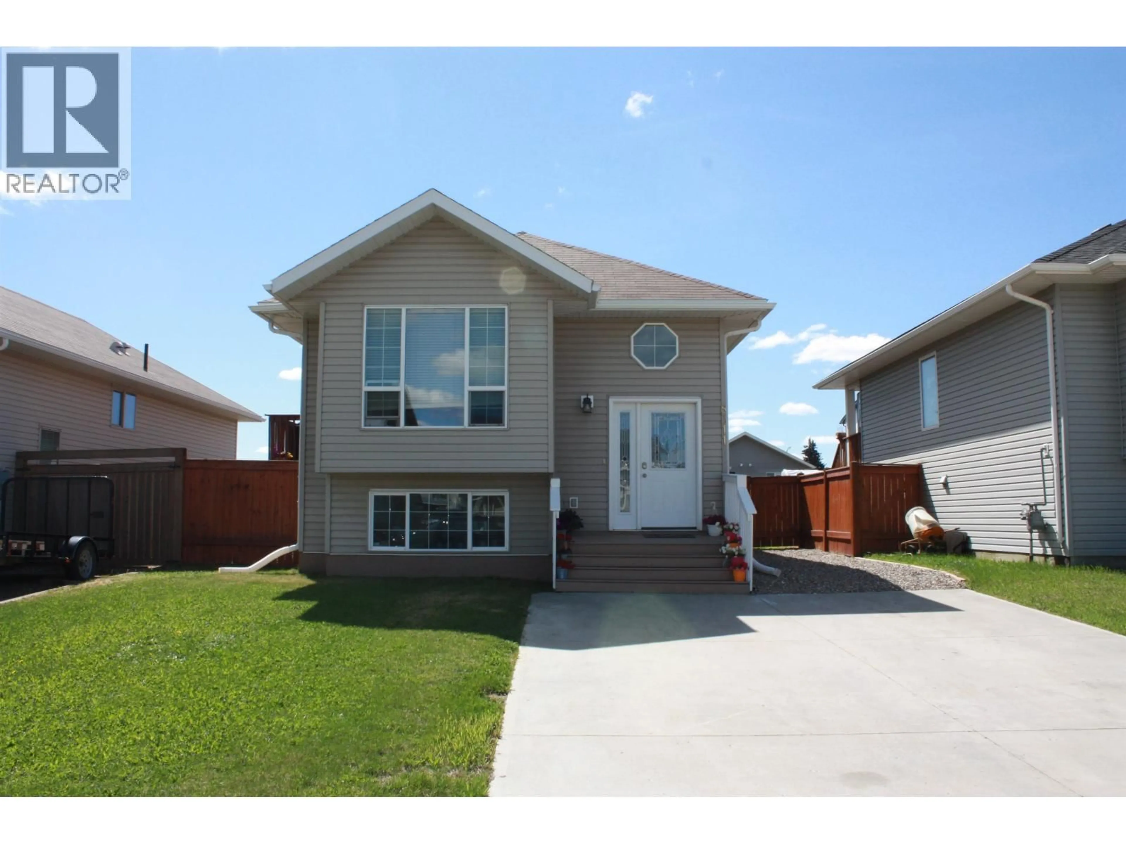 Home with vinyl exterior material, street for 8311 86 AVENUE, Fort St. John British Columbia V1J0G4