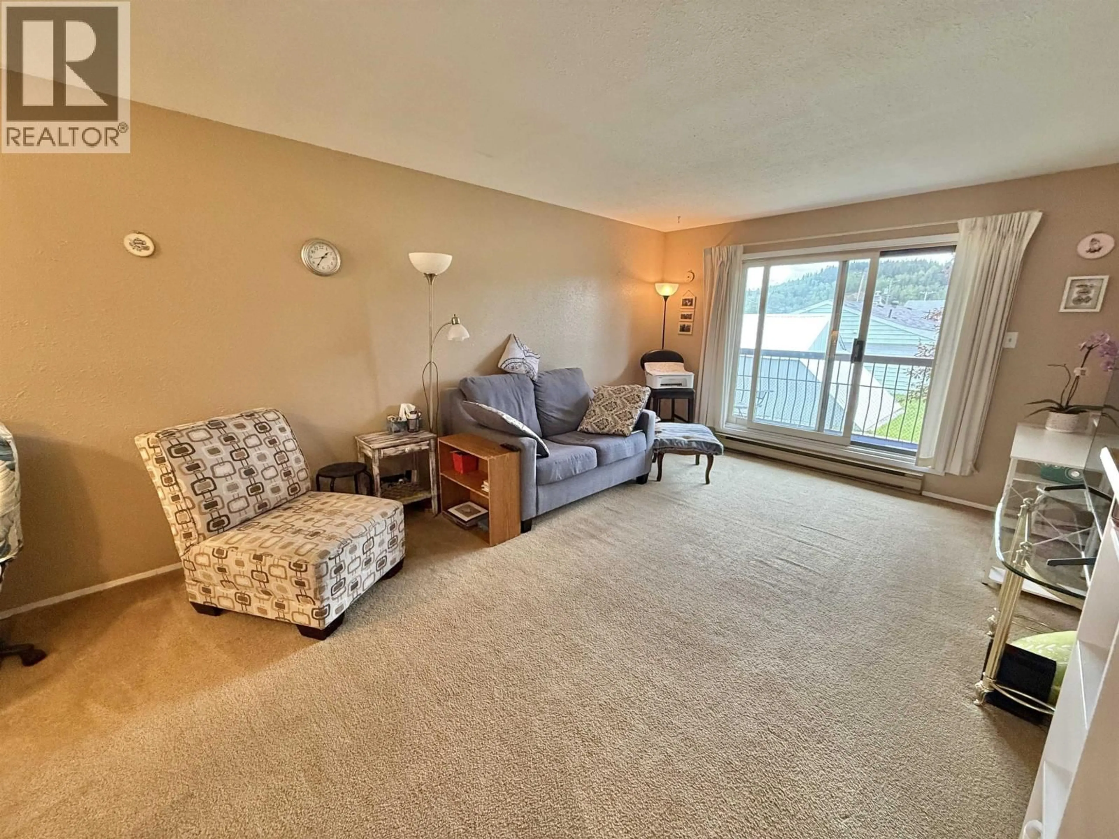 Living room with furniture, carpet floor for 203 - 398 RODDIS DRIVE, Quesnel British Columbia V2J1A6