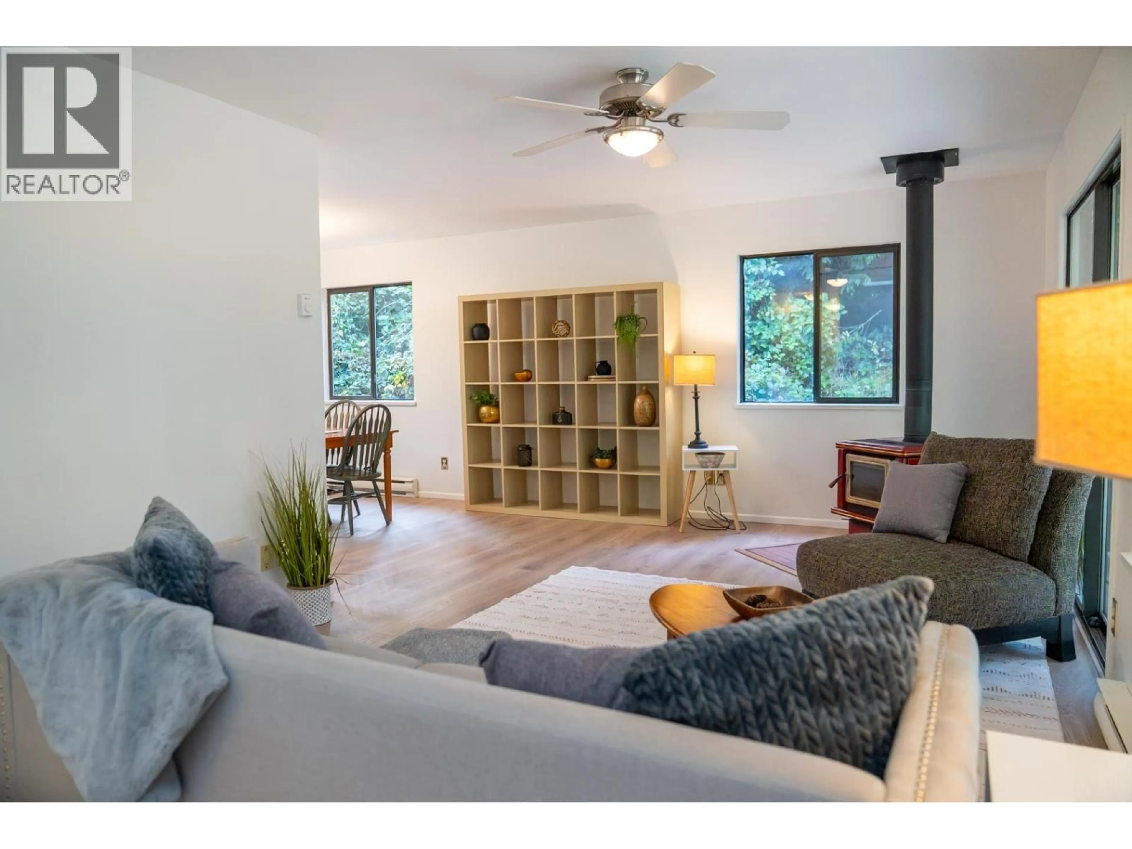Living room with furniture, wood/laminate floor for 37150 SCHOONER WAY, Pender Island British Columbia V0N2M2