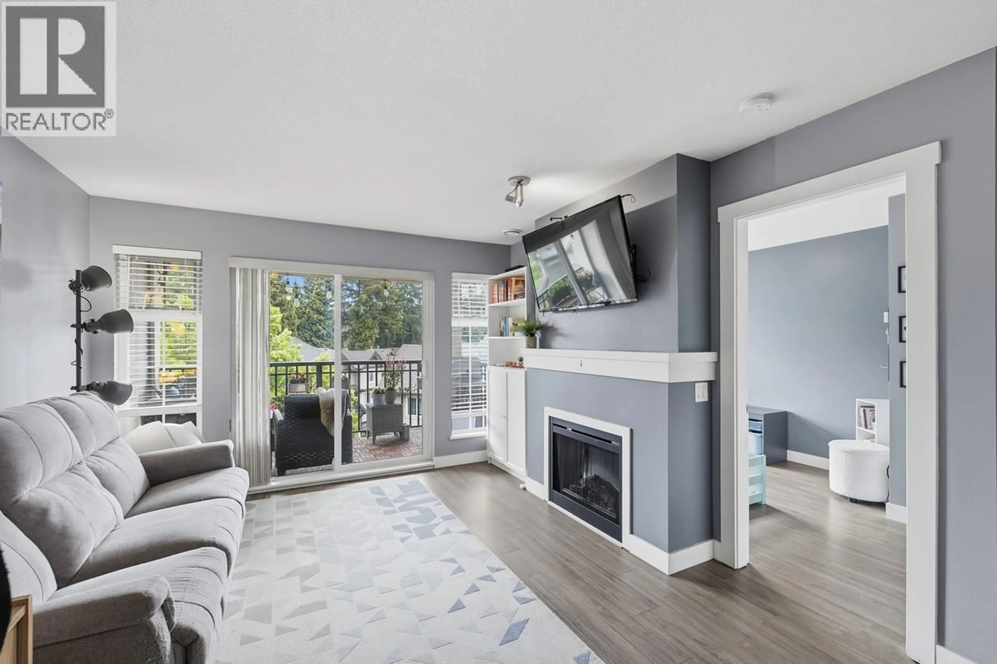 Living room with furniture, wood/laminate floor for 411 - 9233 GOVERNMENT STREET, Burnaby British Columbia V3N0A3