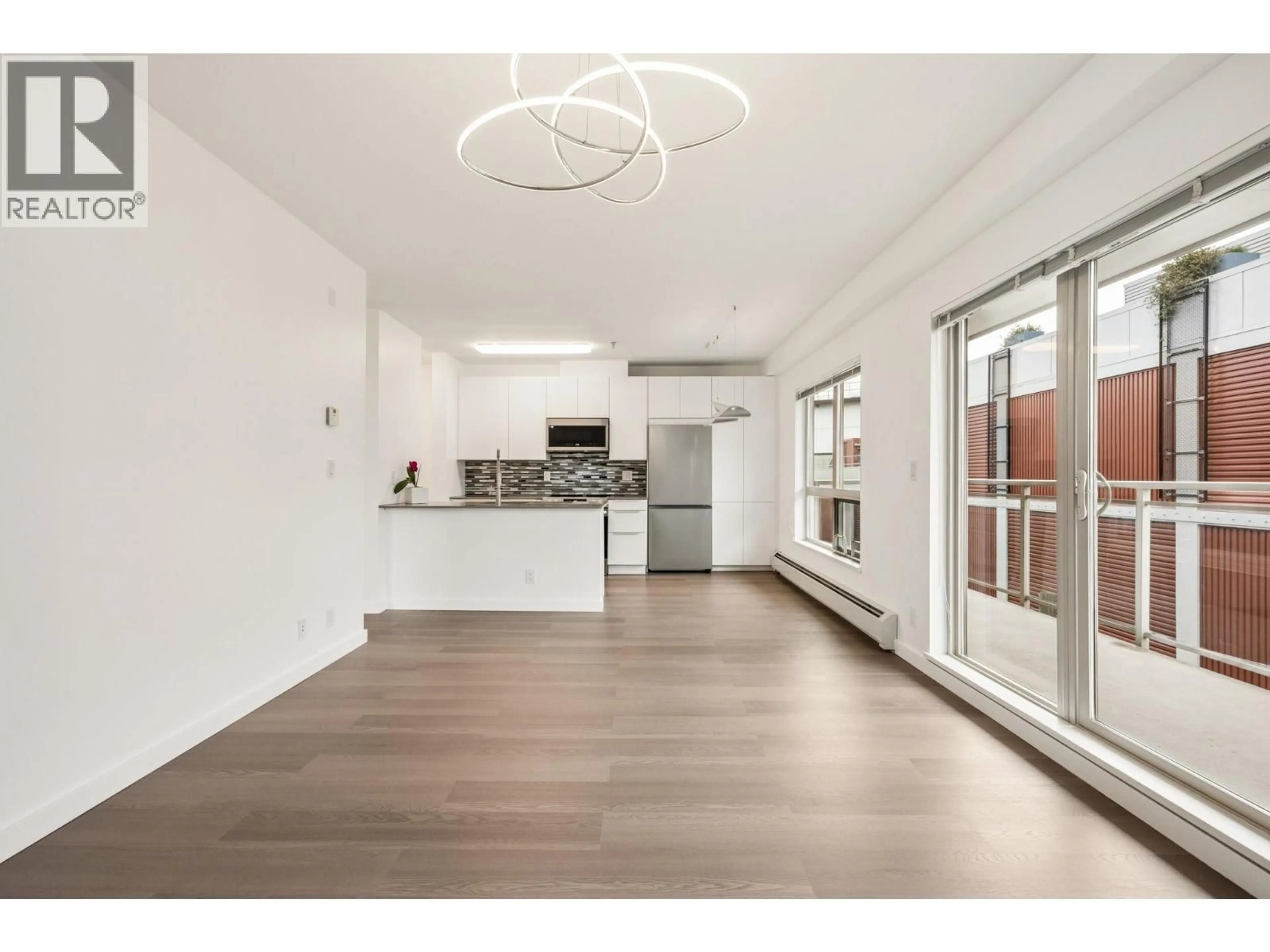 Open concept kitchen, wood/laminate floor for 303 - 1033 ST. GEORGES AVENUE, North Vancouver British Columbia V7L3H5
