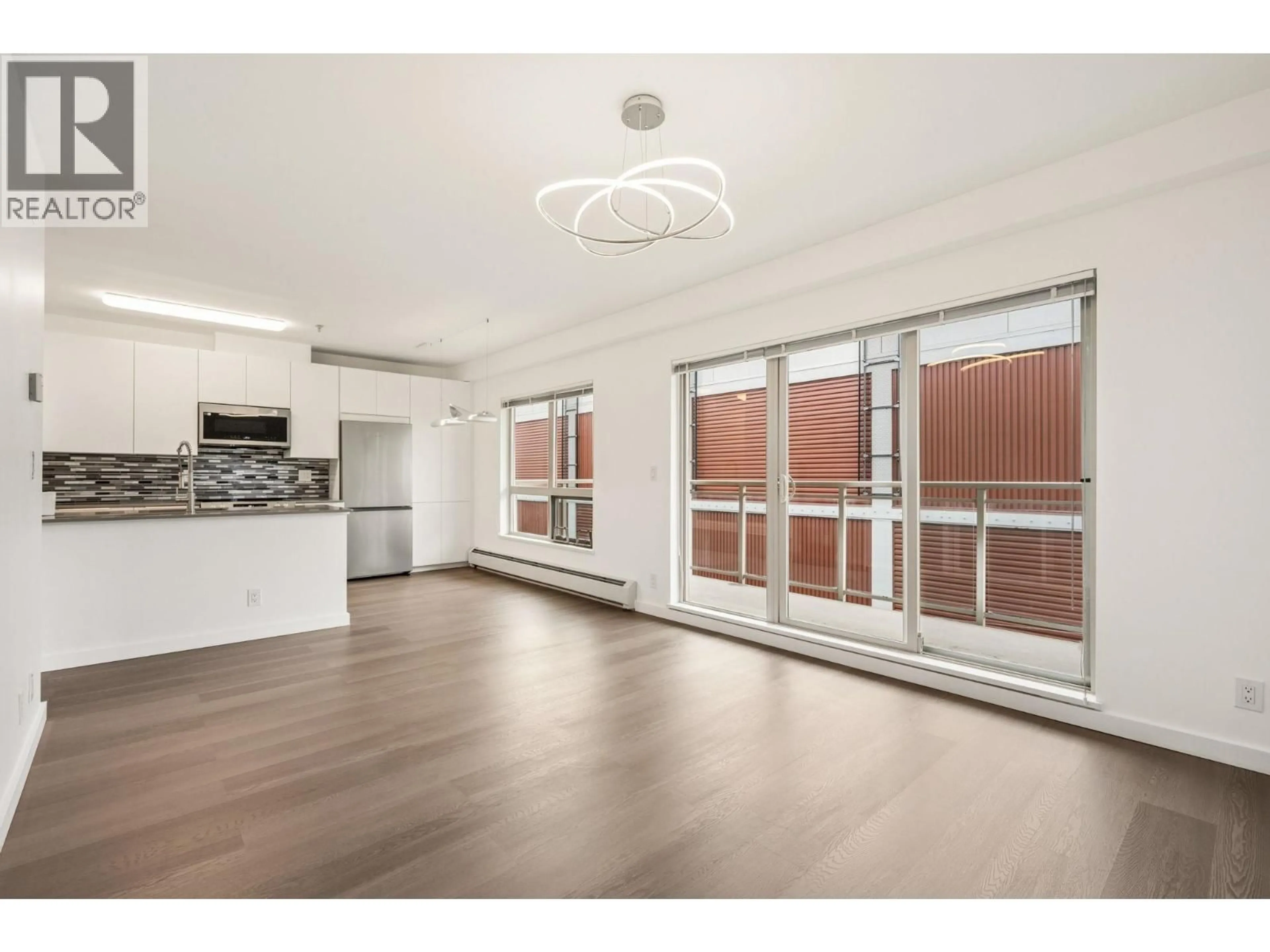Open concept kitchen, wood/laminate floor for 303 - 1033 ST. GEORGES AVENUE, North Vancouver British Columbia V7L3H5