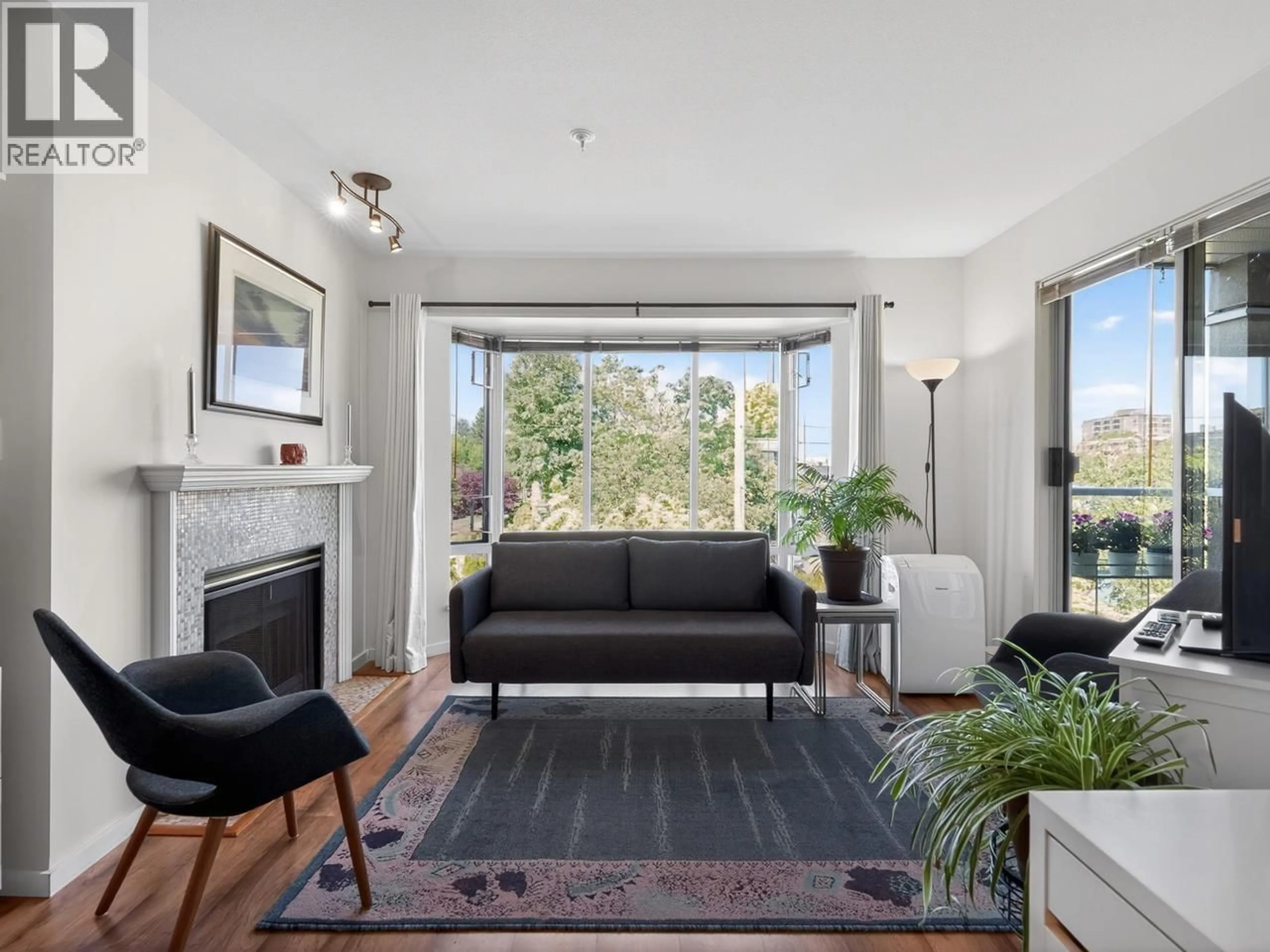 Living room with furniture, wood/laminate floor for 305 - 2195 5TH AVENUE, Vancouver British Columbia V6K1S1