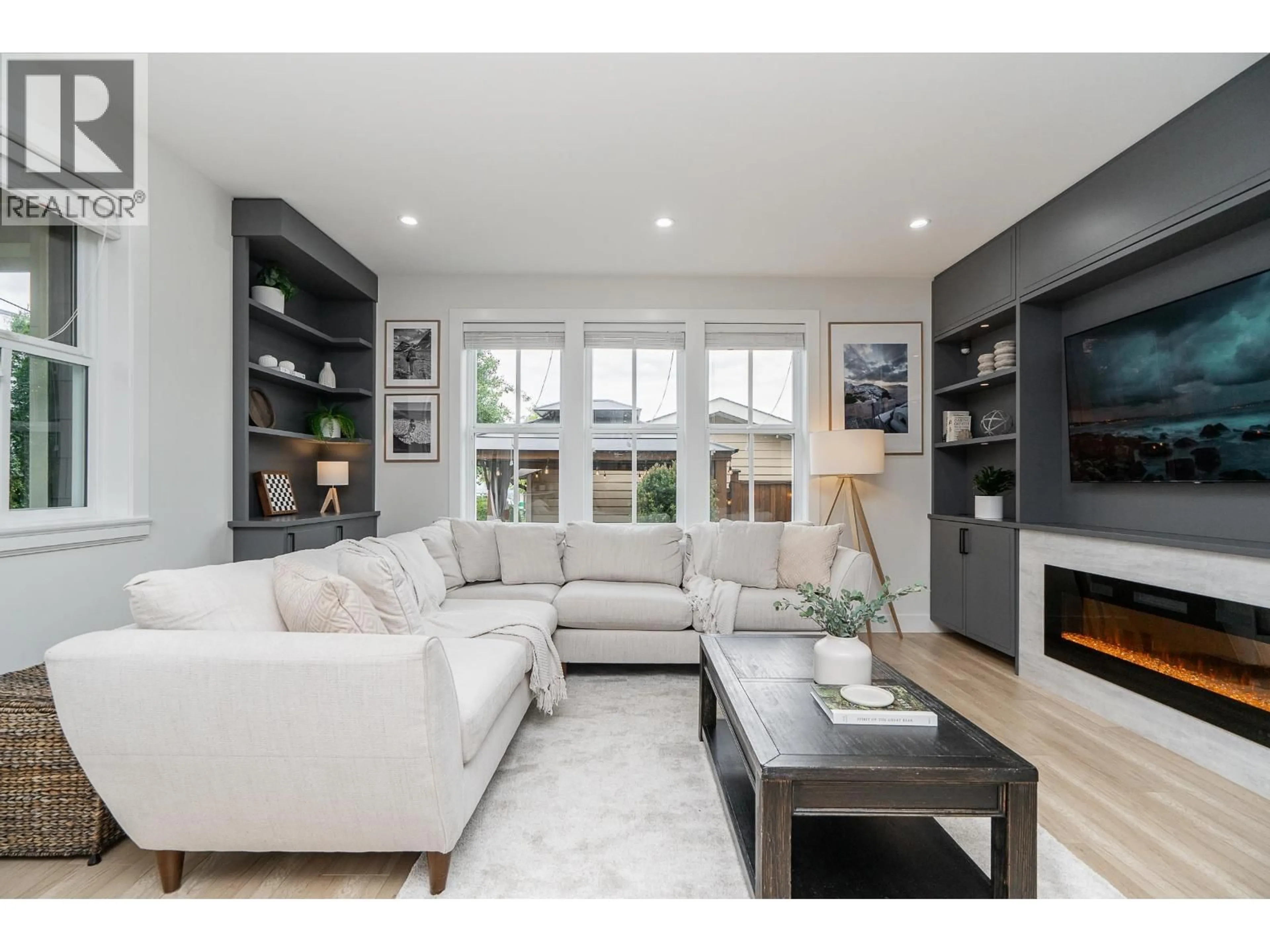 Living room with furniture, wood/laminate floor for 108 - 3416 QUEENSTON AVENUE, Coquitlam British Columbia V3E3H1