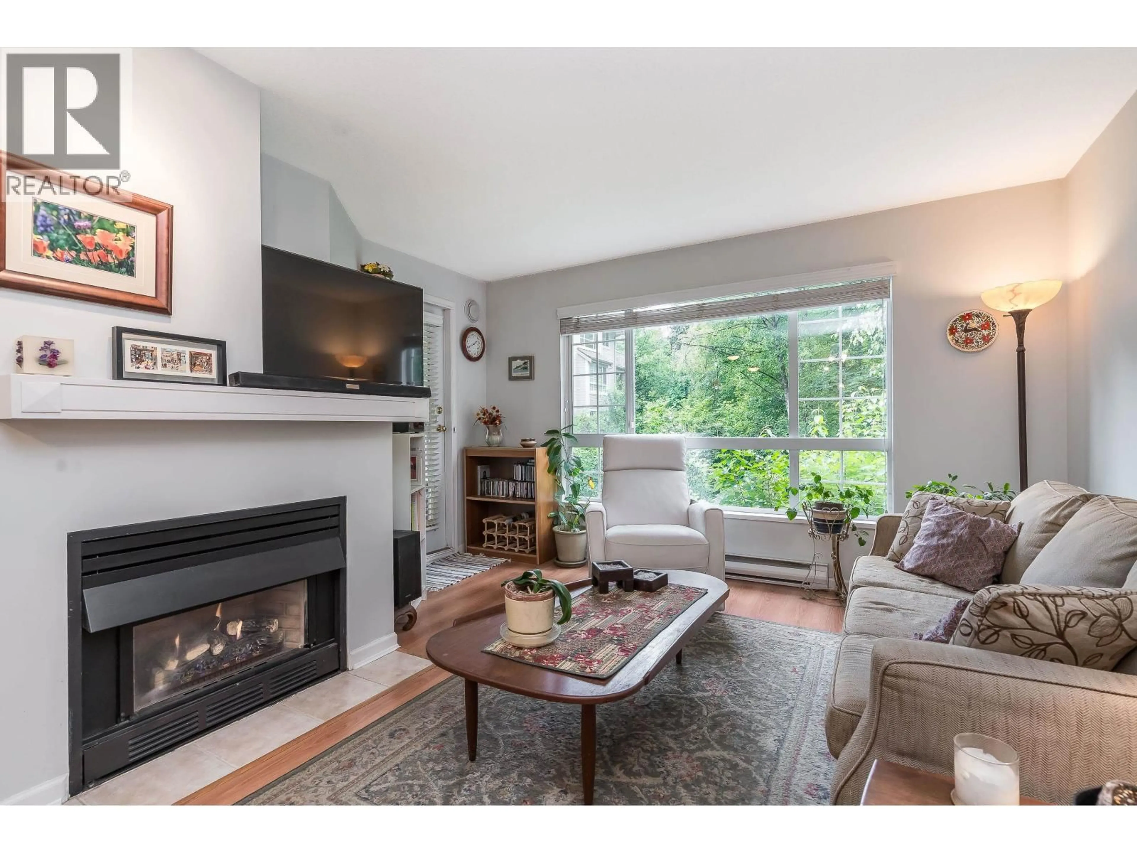 Living room with furniture, wood/laminate floor for 216 - 1242 TOWN CENTRE BOULEVARD, Coquitlam British Columbia V3B7R6