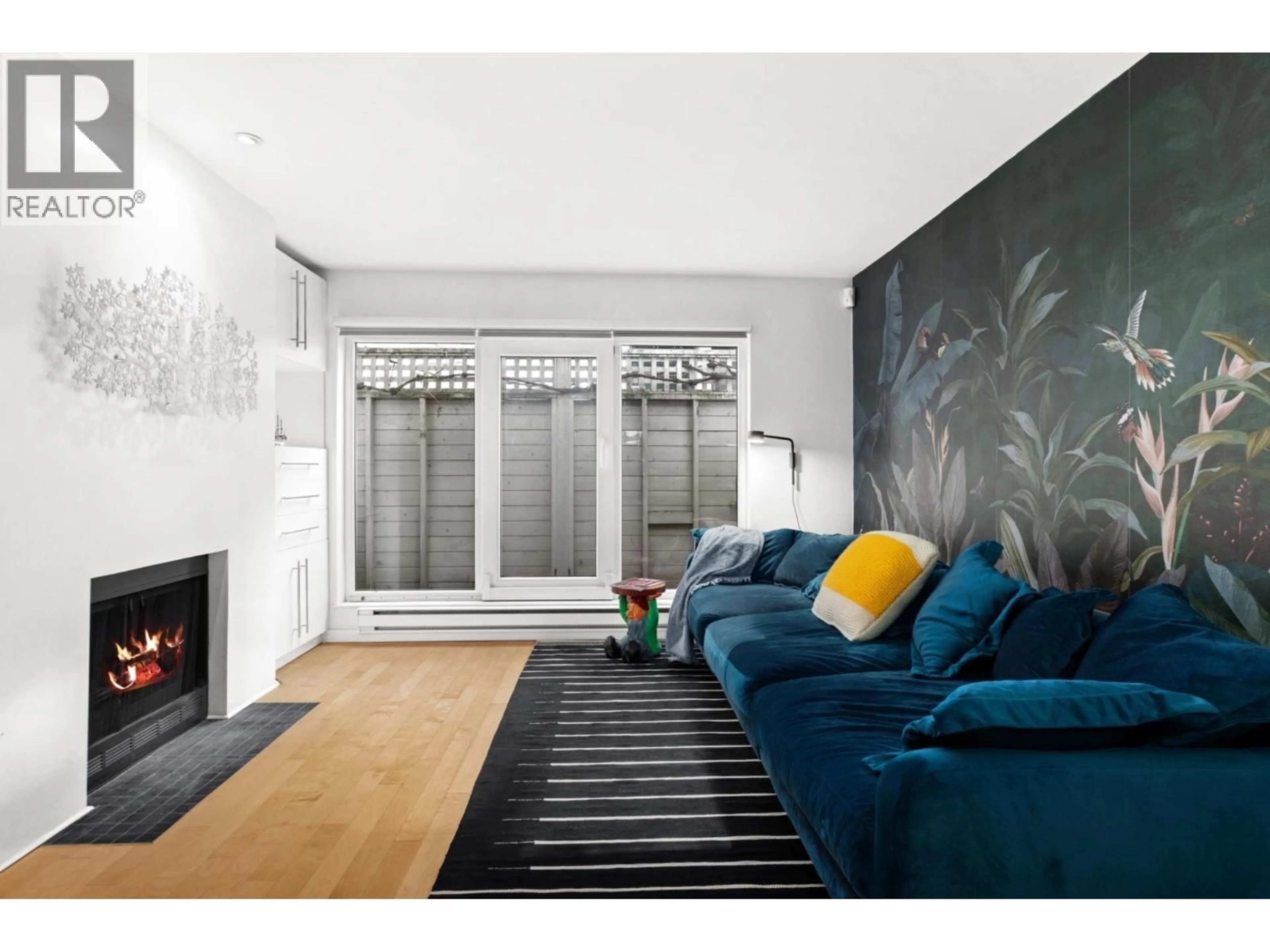 Living room with furniture, wood/laminate floor for 1286 7TH AVENUE, Vancouver British Columbia V6H1B6