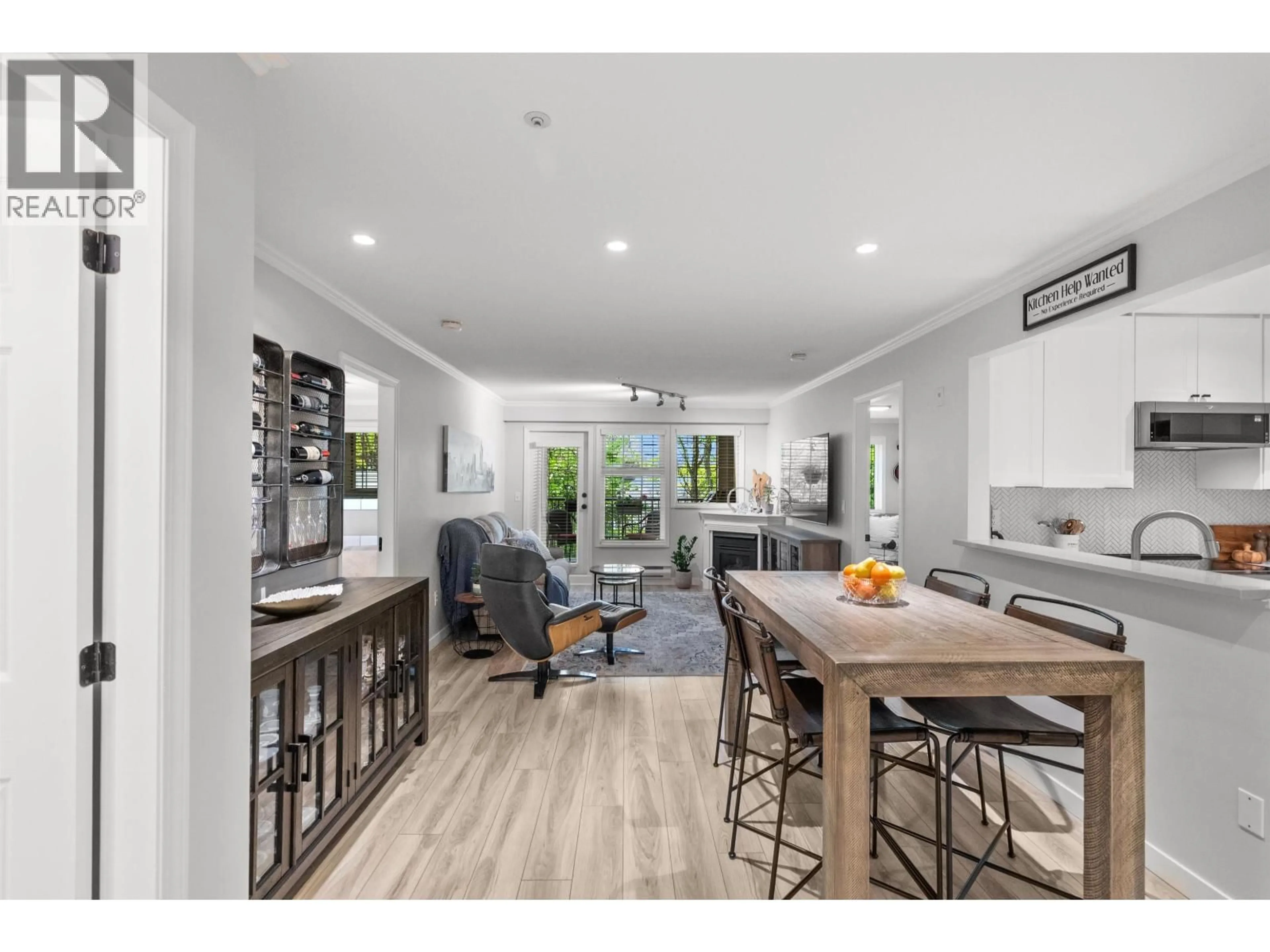 Open concept kitchen, wood/laminate floor for 304 - 5556 14 AVENUE, Tsawwassen British Columbia V4M4E7