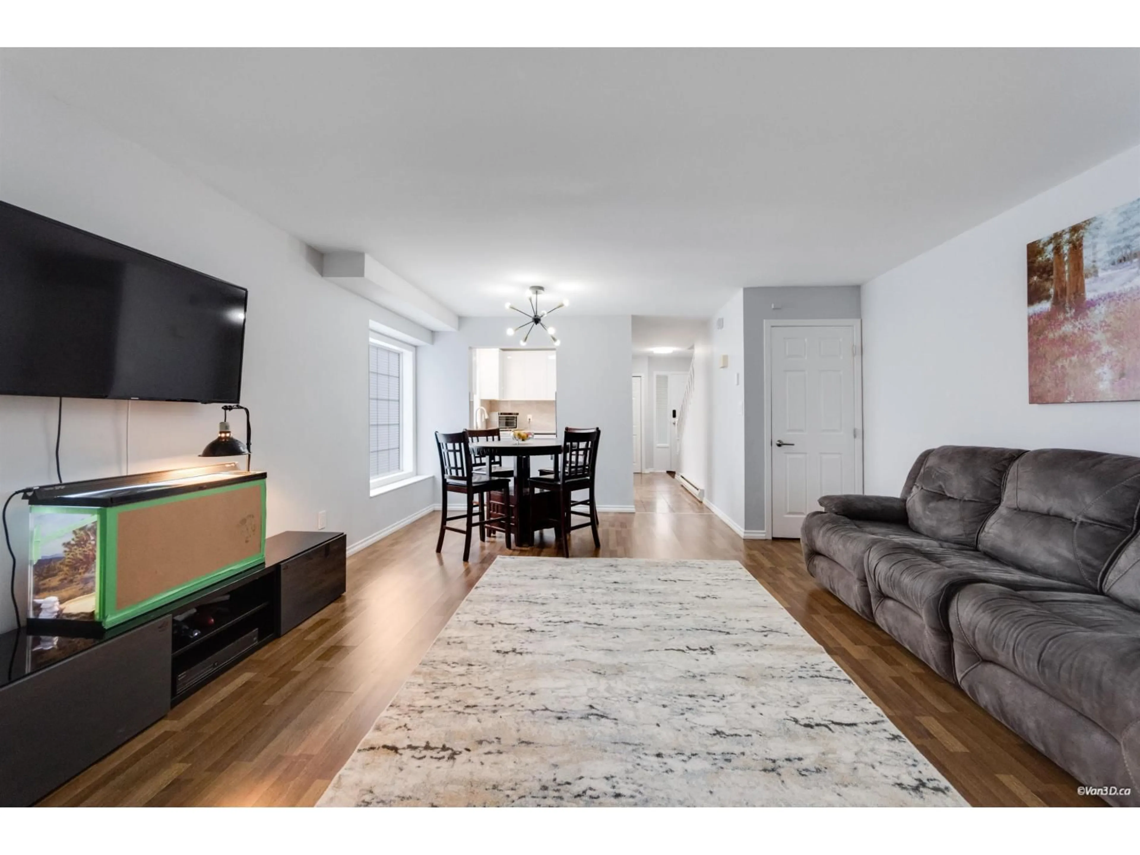 Living room with furniture, wood/laminate floor for 1 - 9437 HAZEL STREET, Chilliwack British Columbia V2P5M9