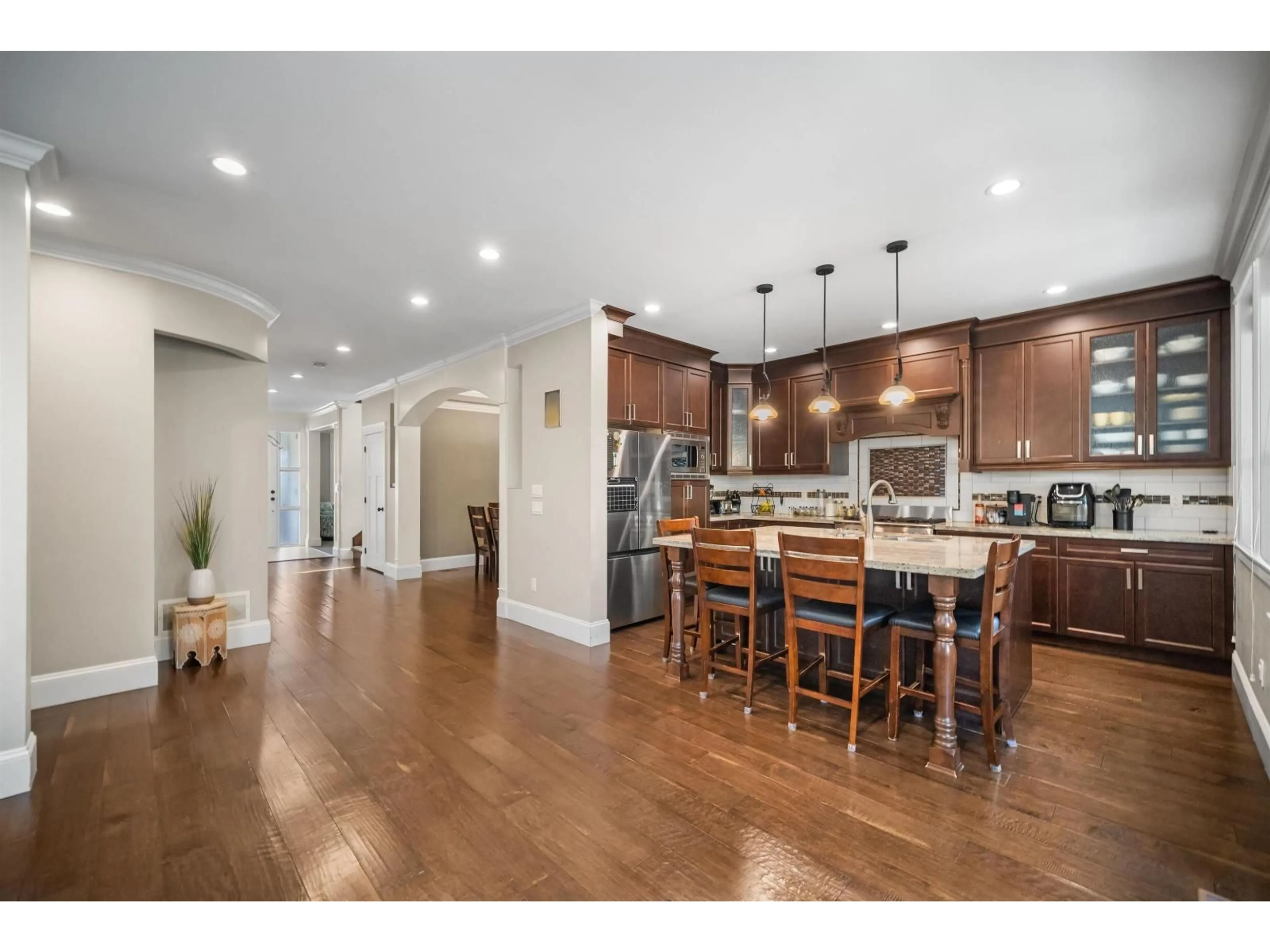 Open concept kitchen, wood/laminate floor for 2343 MERLOT BOULEVARD, Abbotsford British Columbia V4X0A6