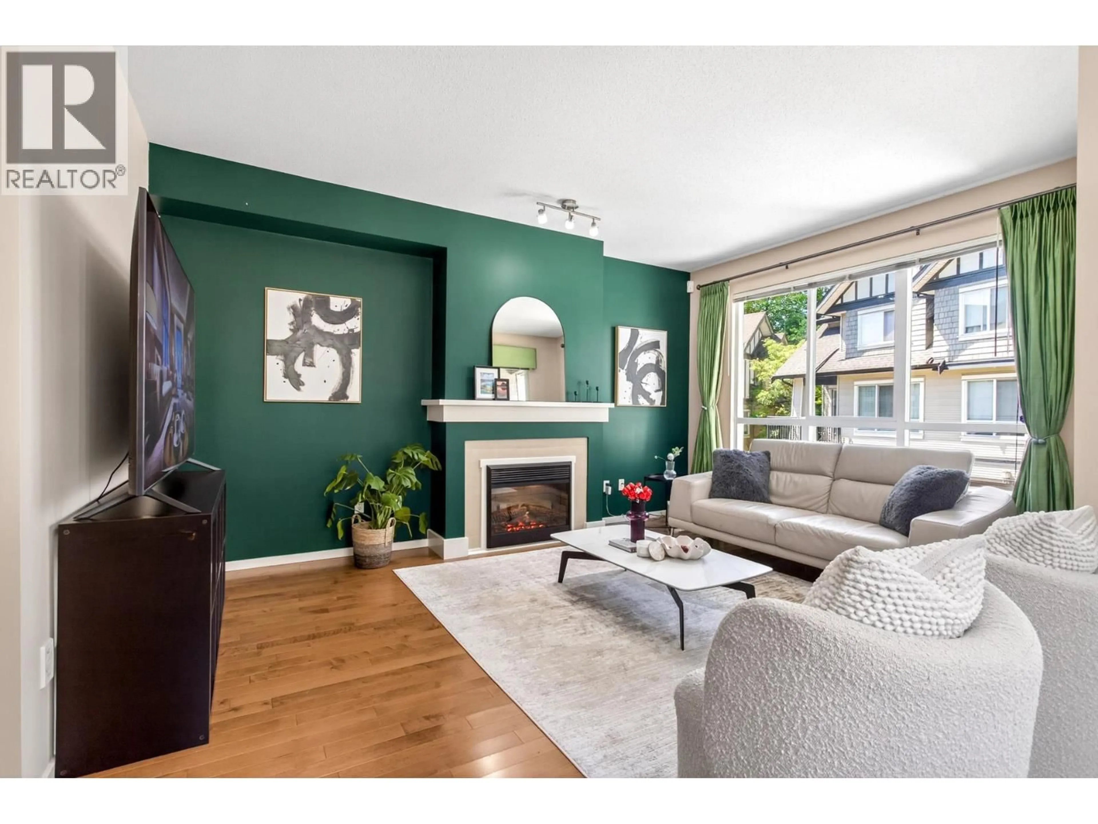 Living room with furniture, wood/laminate floor for 120 - 9133 GOVERNMENT STREET, Burnaby British Columbia V3N0B1