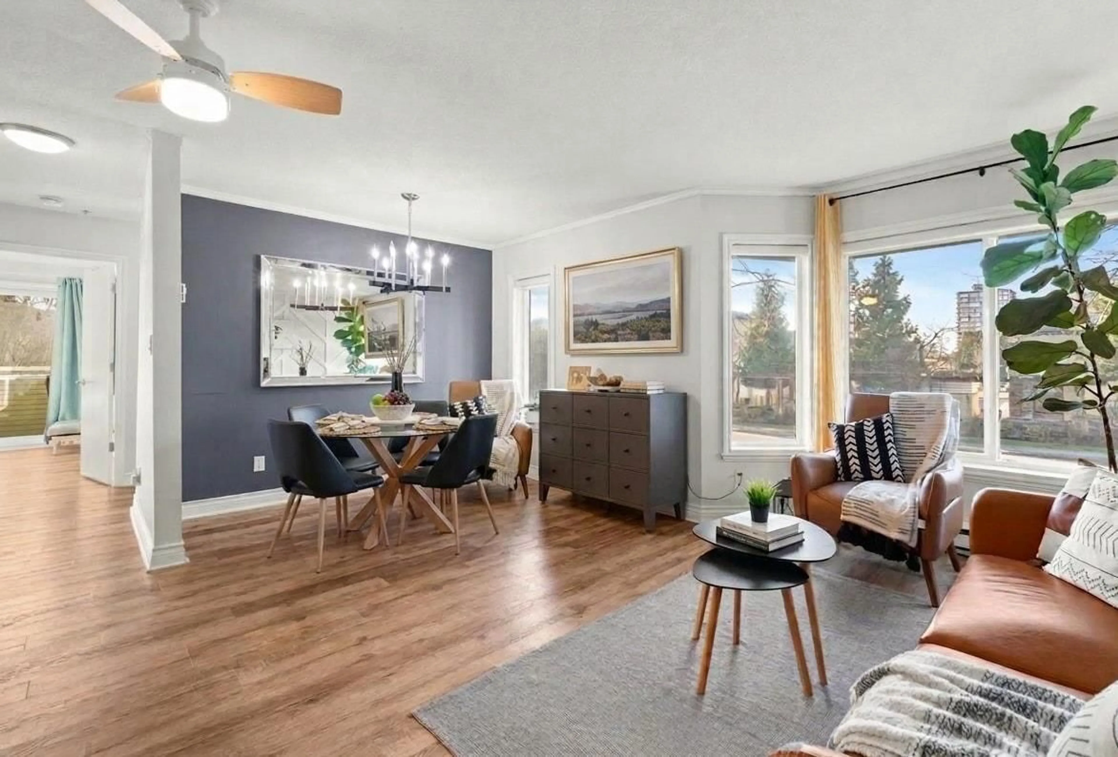 Living room with furniture, wood/laminate floor for 201 - 12110 80 AVENUE, Surrey British Columbia V3W0V2
