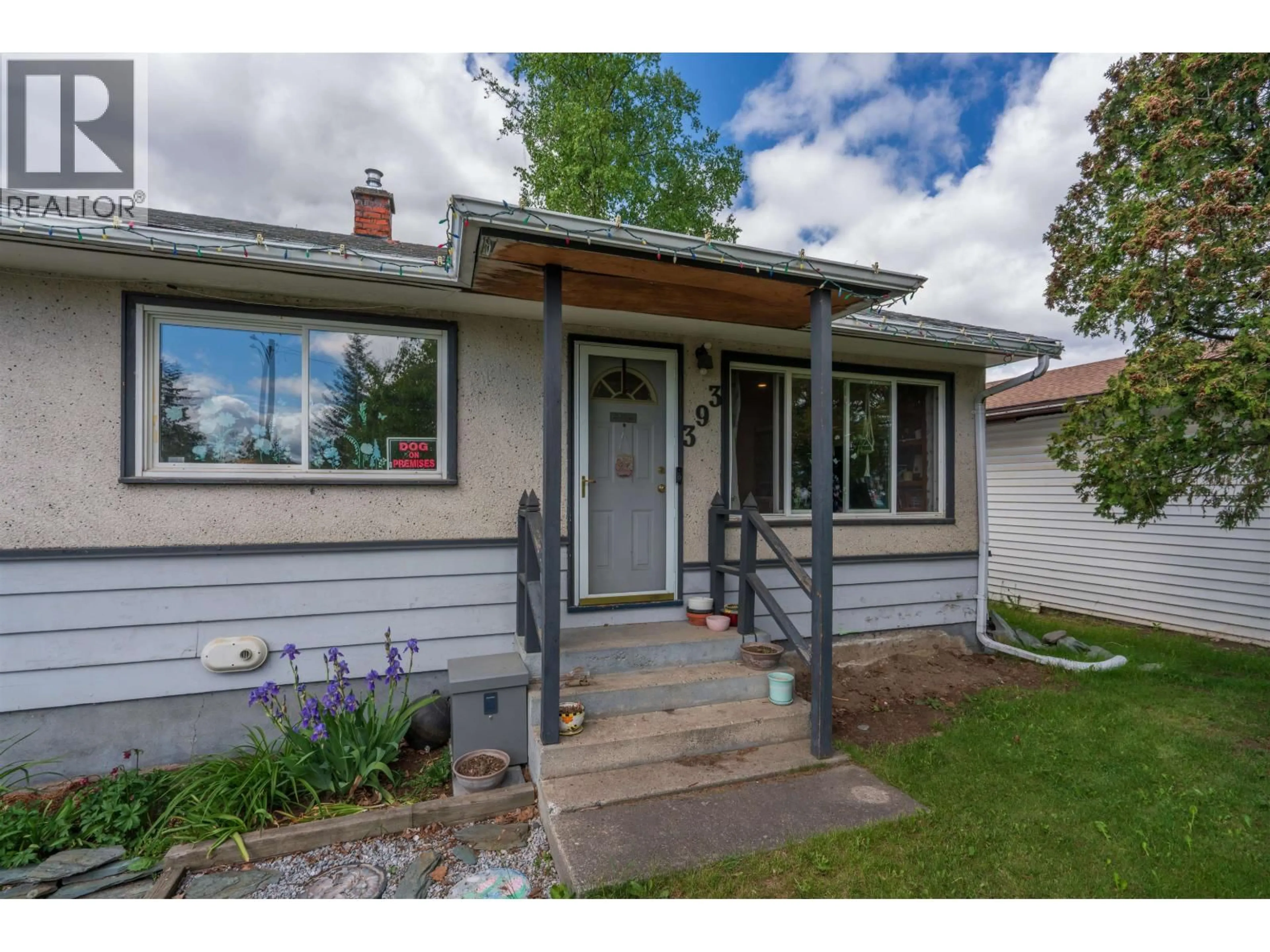 Home with vinyl exterior material, street for 393 IRWIN STREET, Prince George British Columbia V2M2X4