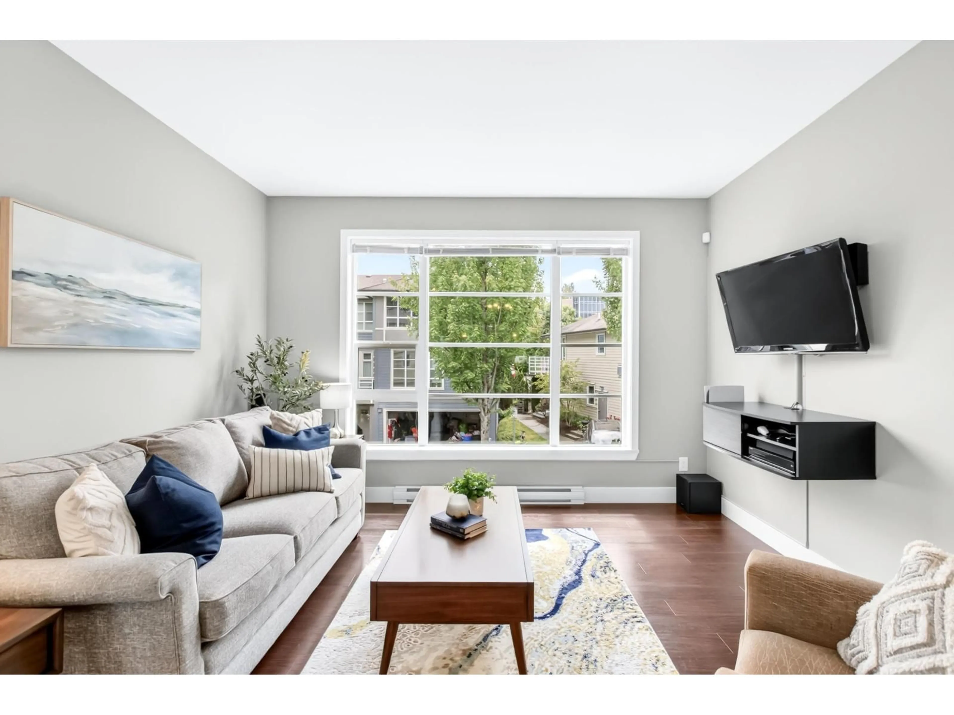 Living room with furniture, wood/laminate floor for 58 - 15405 31 AVENUE, Surrey British Columbia V3Z2W5