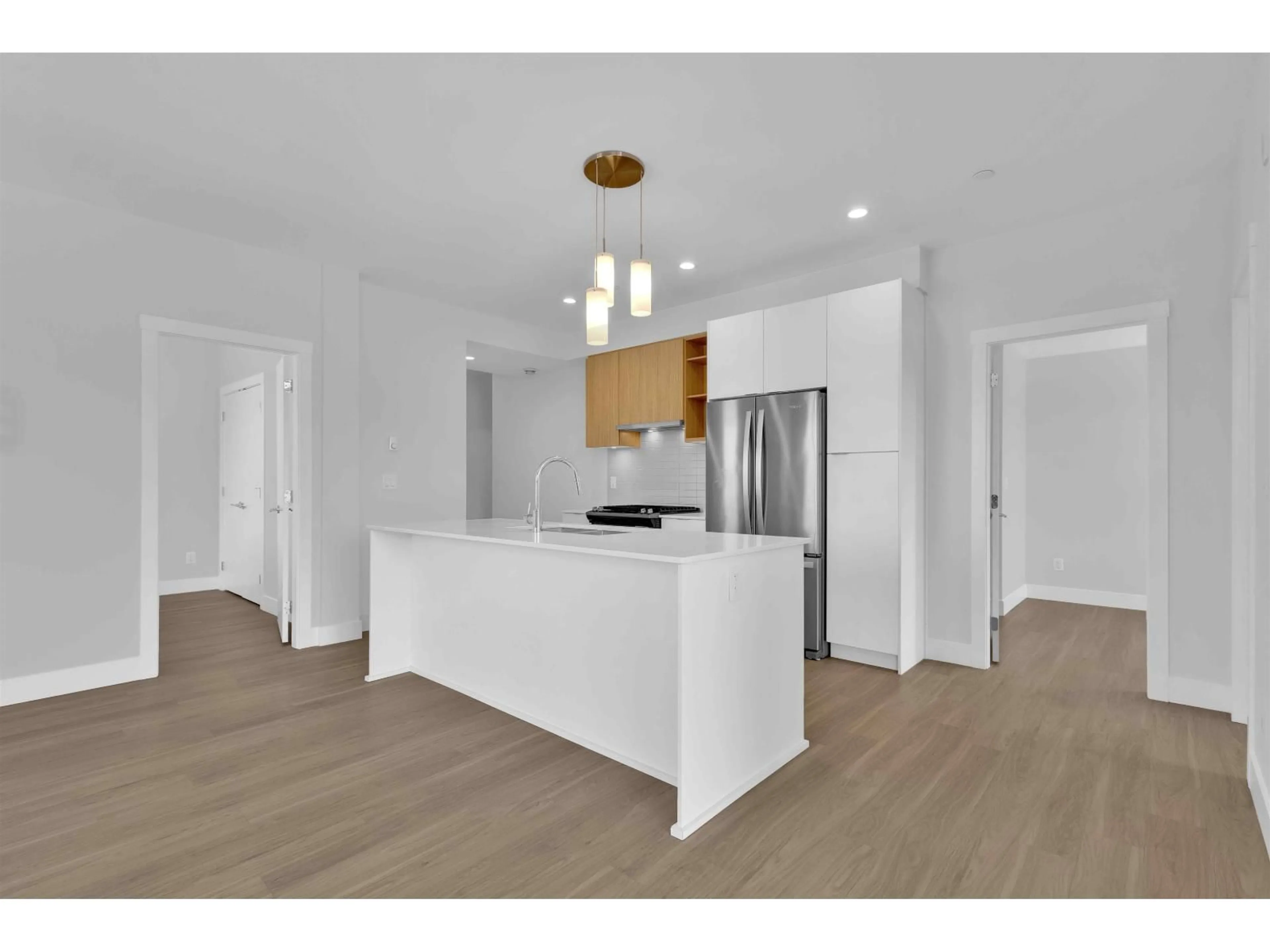 Open concept kitchen, wood/laminate floor for A507 - 6950 NICHOLSON ROAD, Delta British Columbia V4E0A8