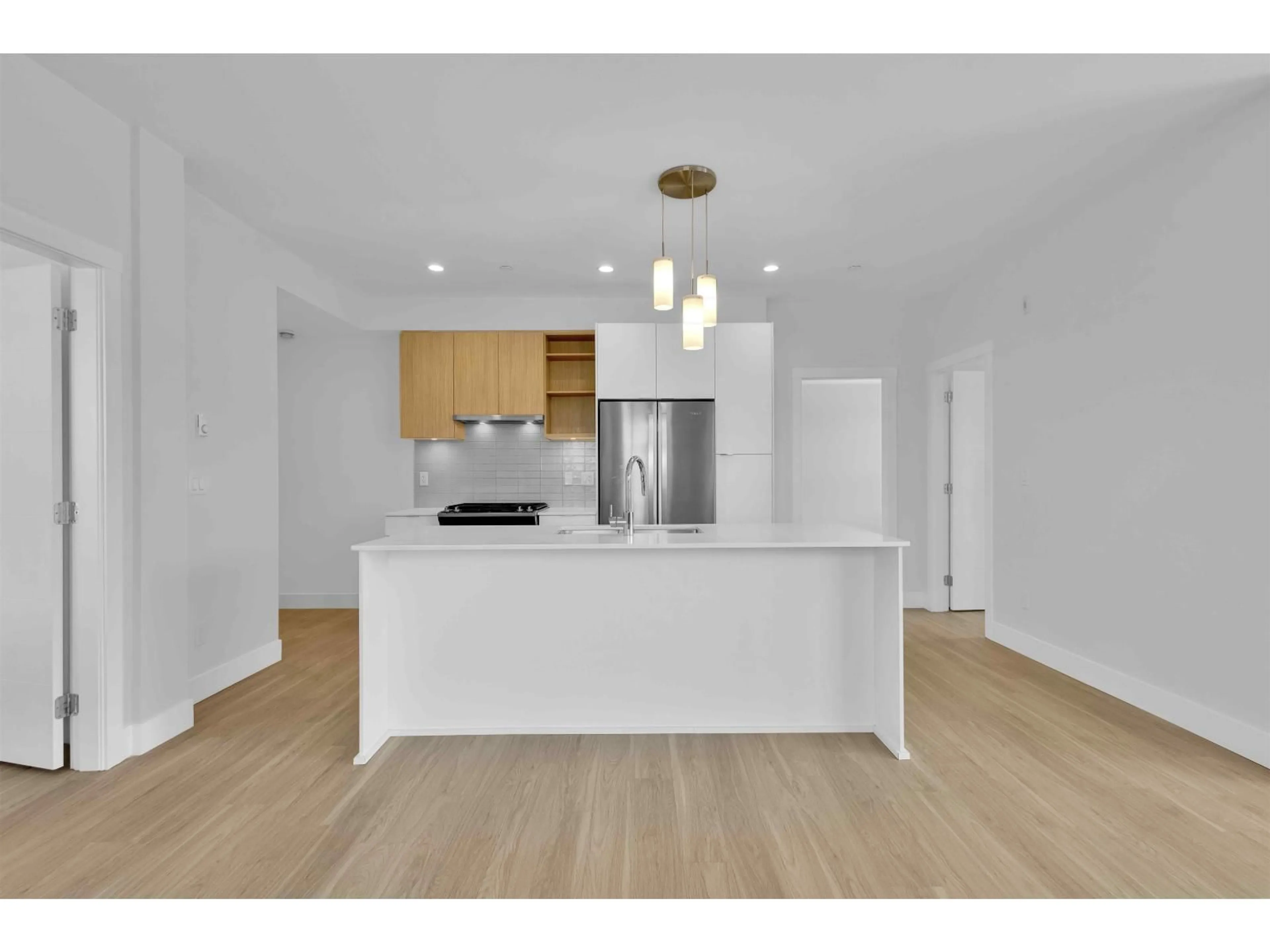 Open concept kitchen, wood/laminate floor for A507 - 6950 NICHOLSON ROAD, Delta British Columbia V4E0A8