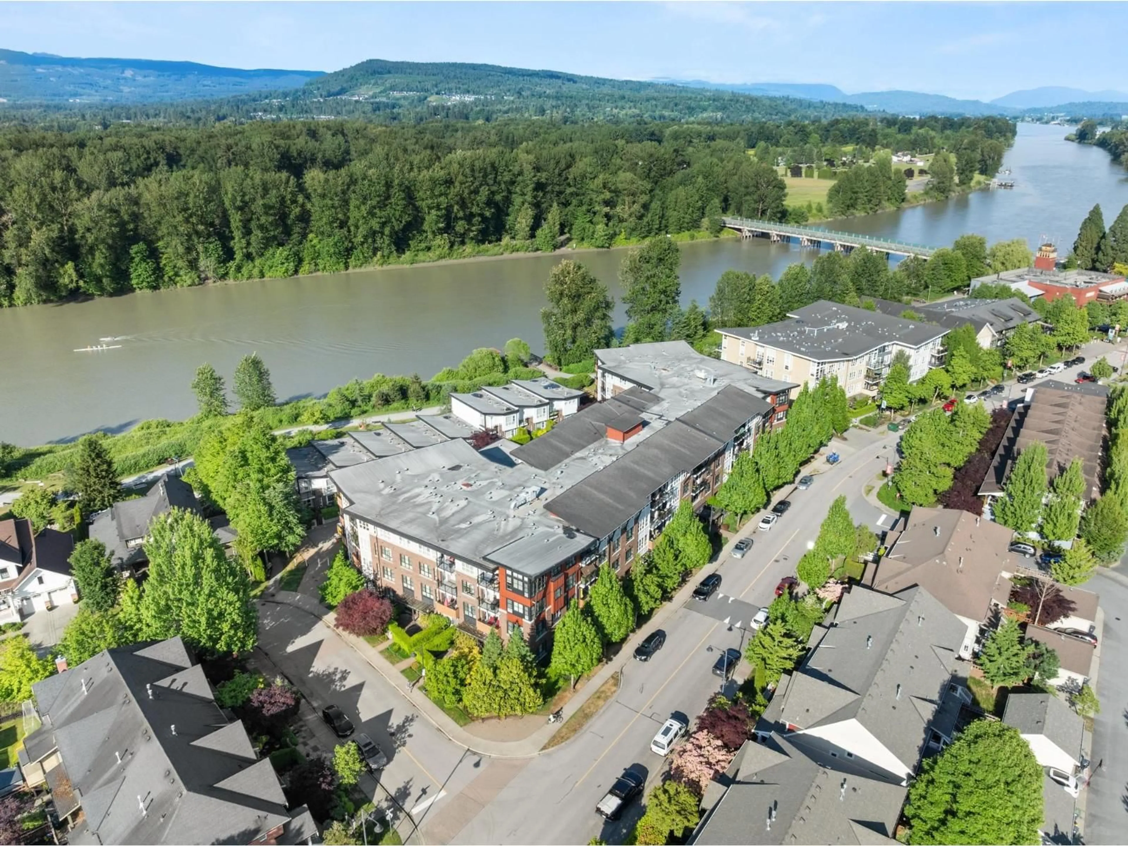 A pic from outside/outdoor area/front of a property/back of a property/a pic from drone, water/lake/river/ocean view for 101 - 23215 BILLY BROWN ROAD, Langley British Columbia V1M0B7