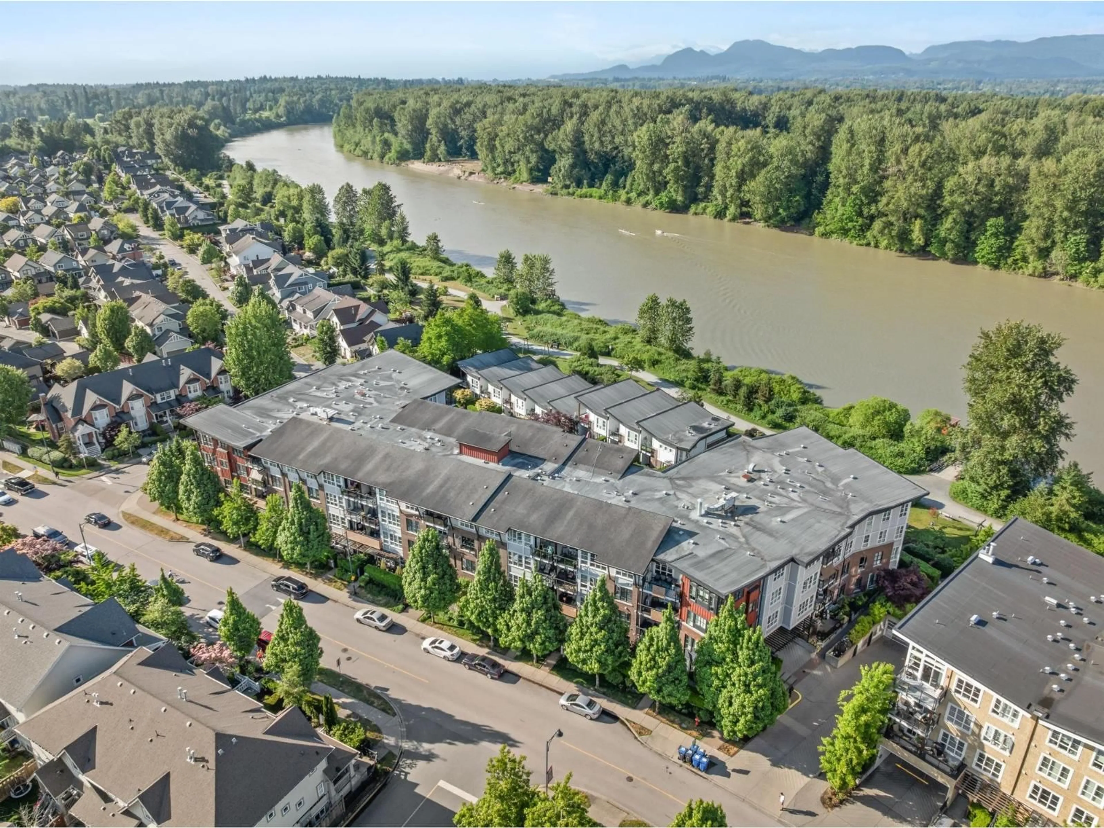 A pic from outside/outdoor area/front of a property/back of a property/a pic from drone, water/lake/river/ocean view for 101 - 23215 BILLY BROWN ROAD, Langley British Columbia V1M0B7