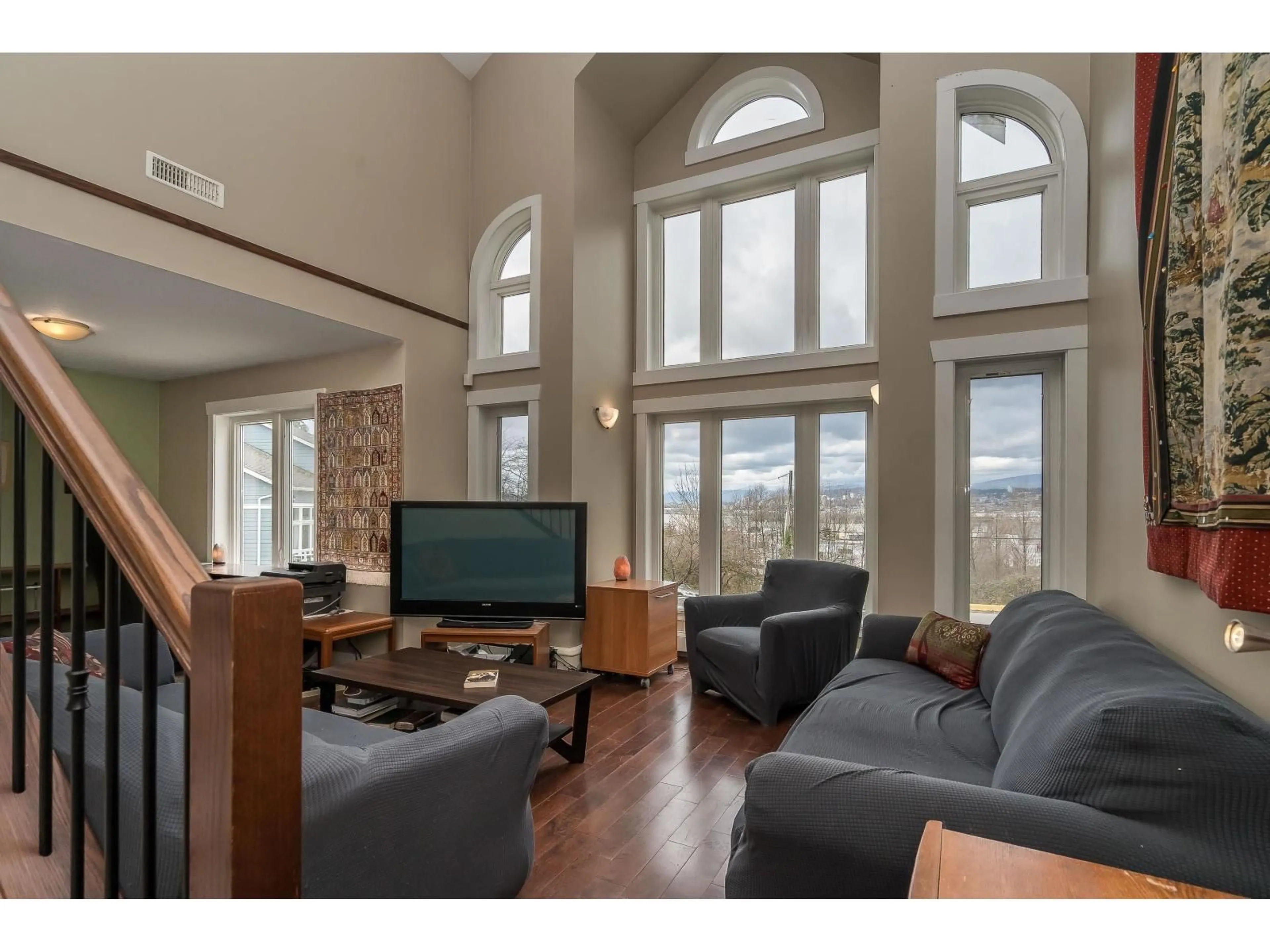 Living room with furniture, wood/laminate floor for 13838 116 AVENUE, Surrey British Columbia V3R2T2