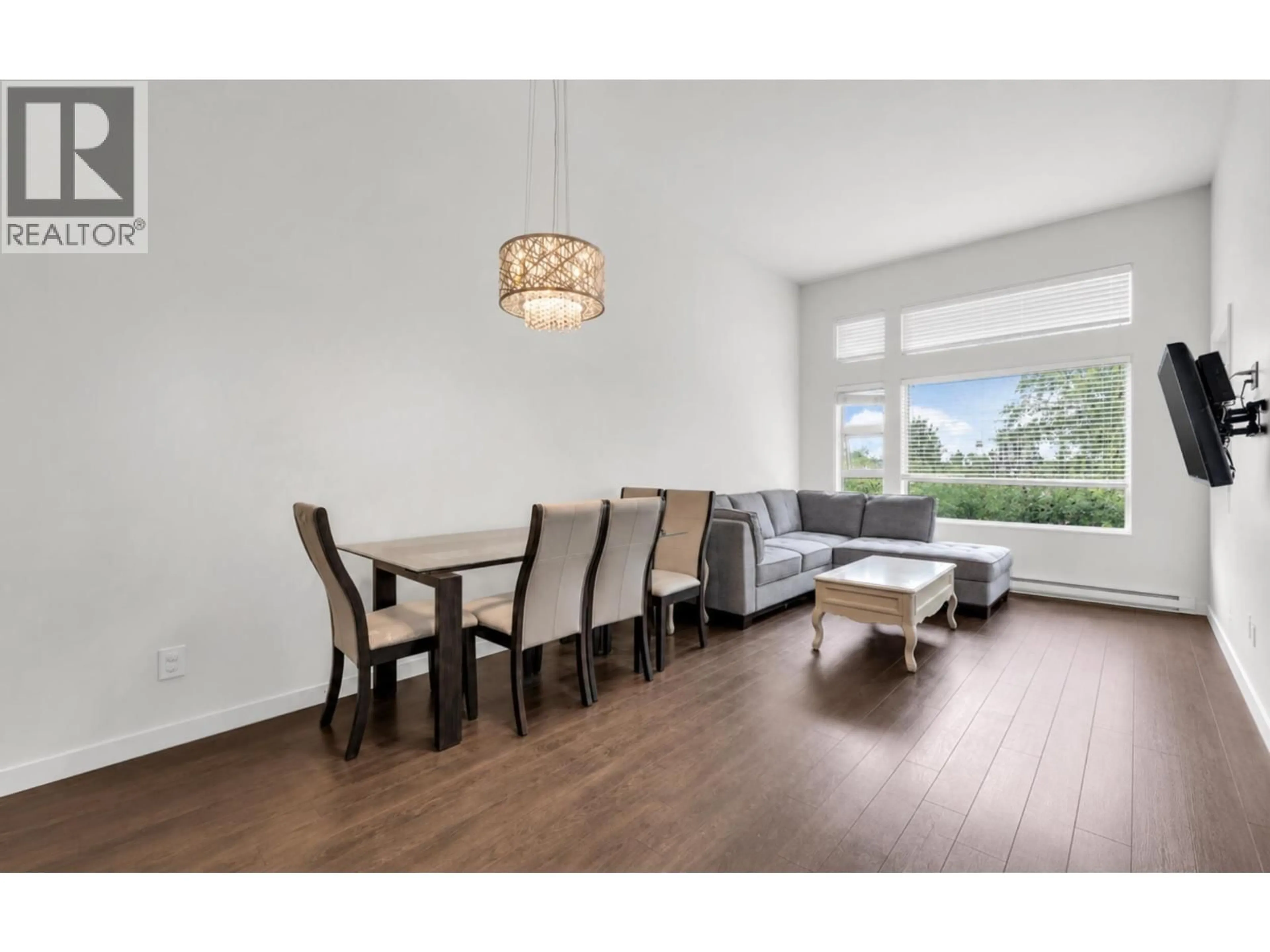 Living room with furniture, wood/laminate floor for 508 - 1677 LLOYD AVENUE, North Vancouver British Columbia V7P0B1
