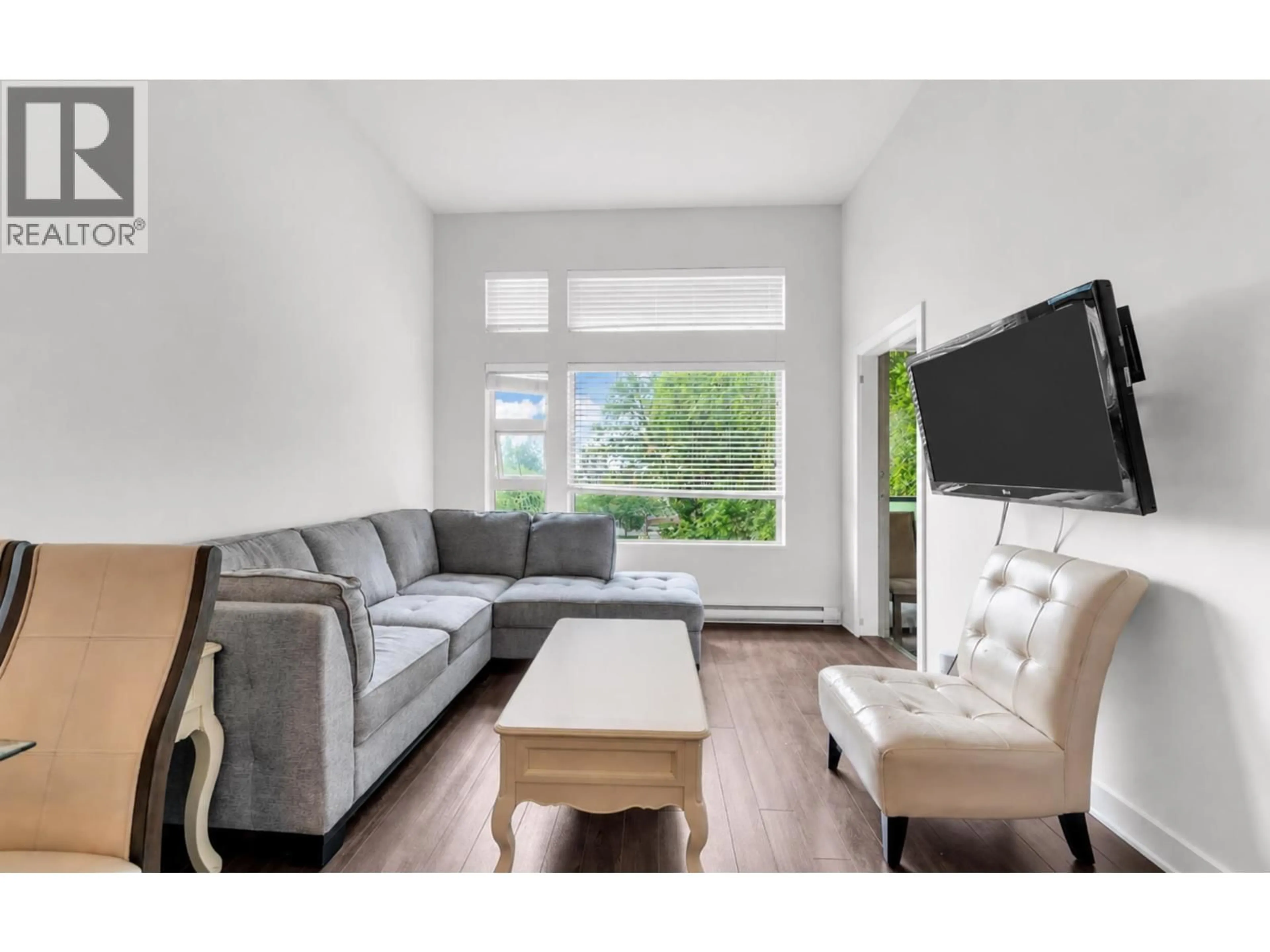 Living room with furniture, wood/laminate floor for 508 - 1677 LLOYD AVENUE, North Vancouver British Columbia V7P0B1
