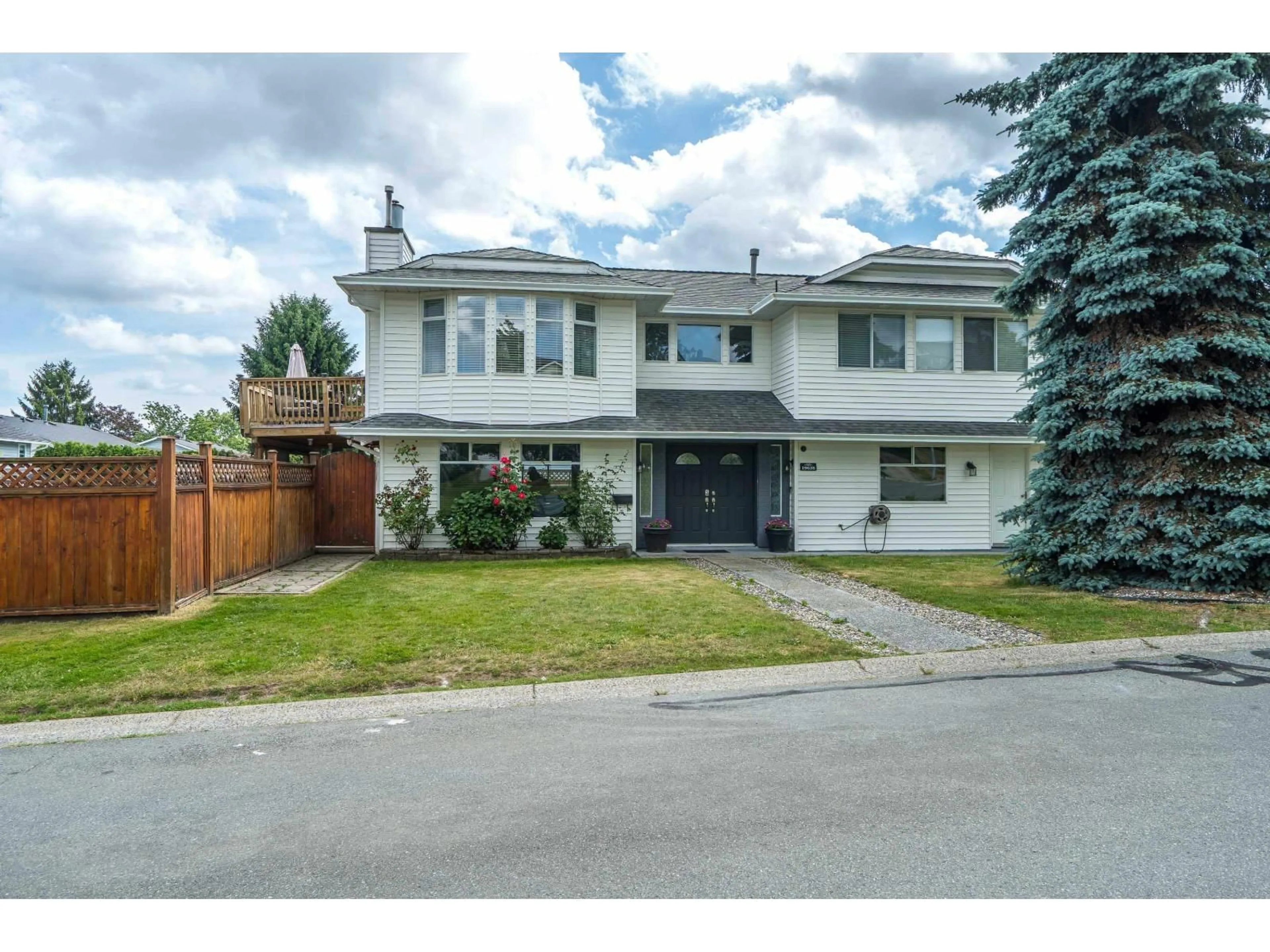 Home with vinyl exterior material, street for 19628 65B PLACE, Langley British Columbia V2Y1K2