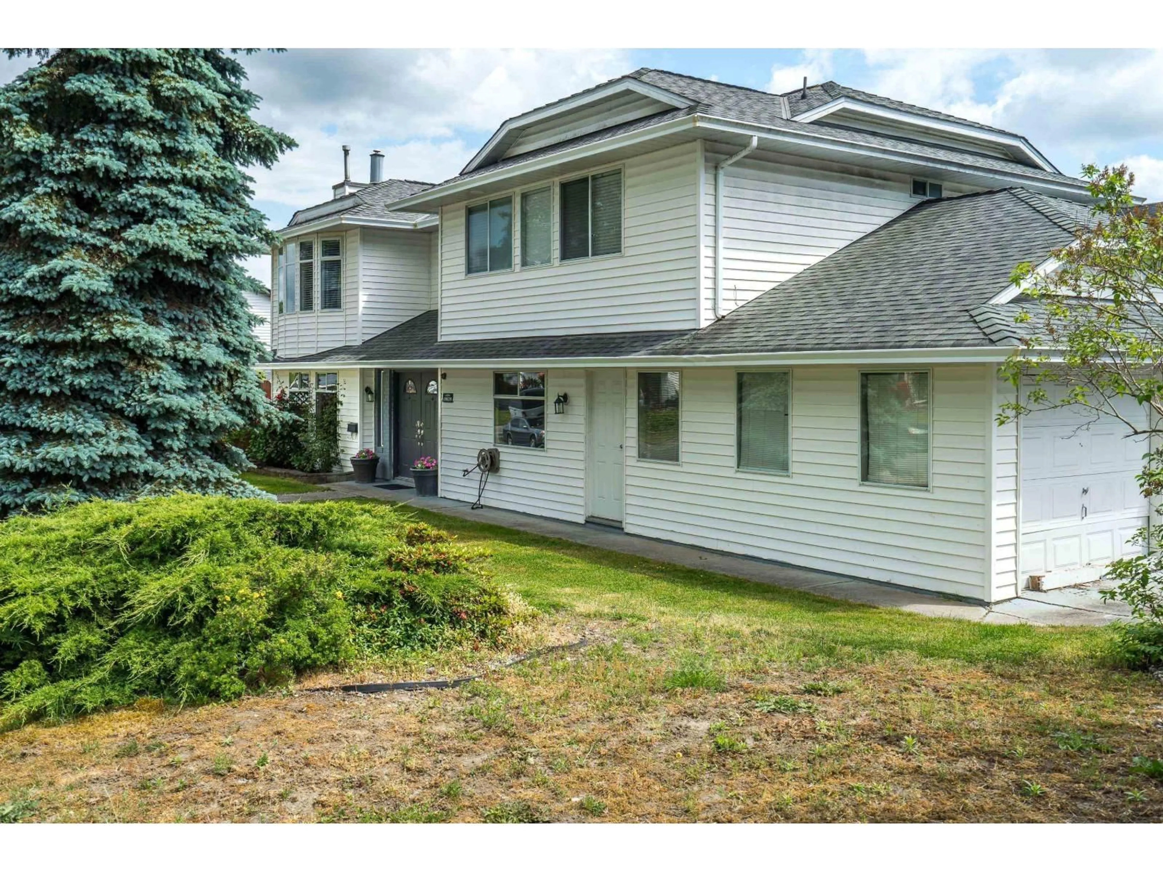 Home with vinyl exterior material, street for 19628 65B PLACE, Langley British Columbia V2Y1K2