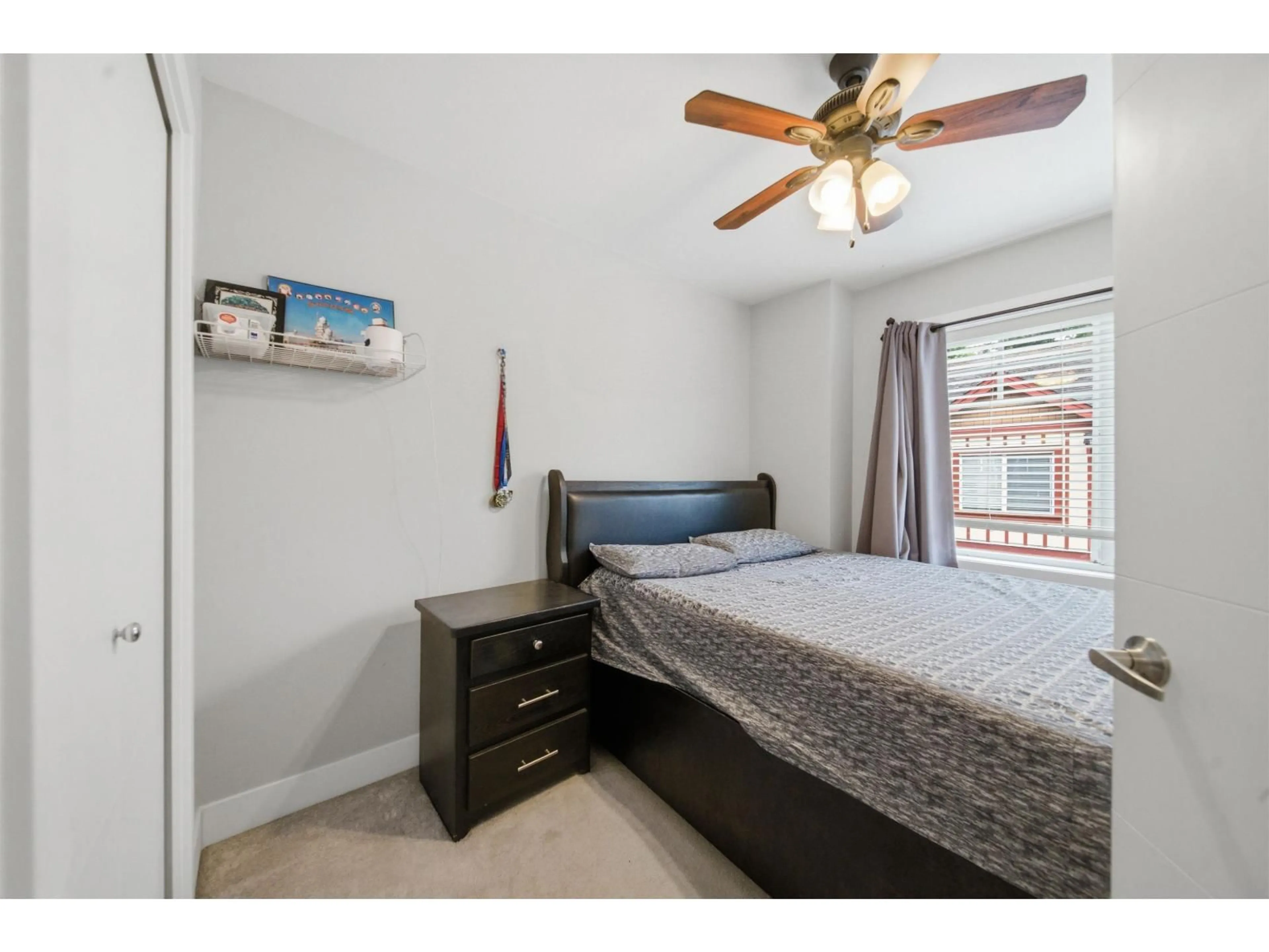 Bedroom with bed, wood/laminate floor for 3 - 6388 140 STREET, Surrey British Columbia V3W1Y8