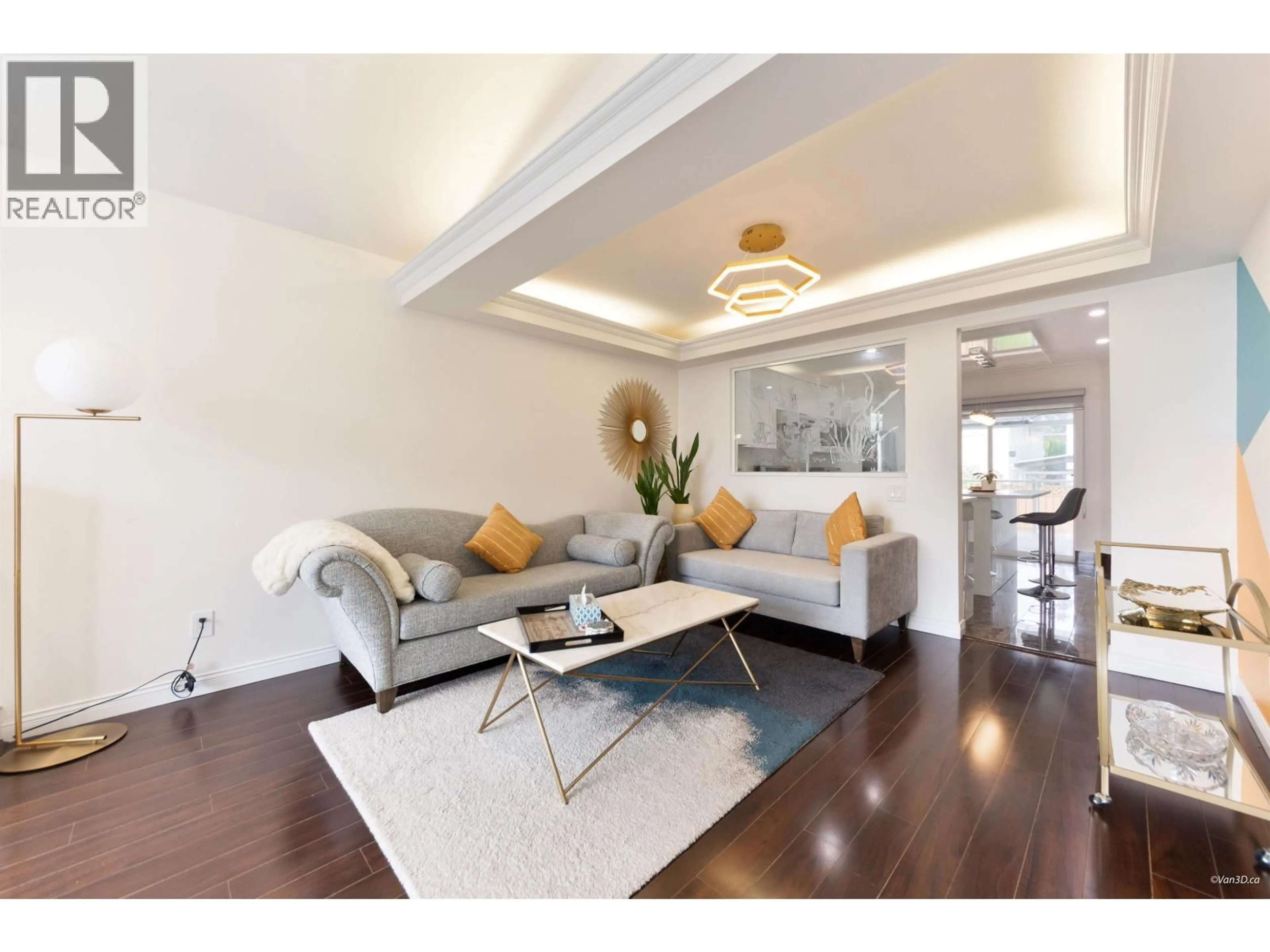 Living room with furniture, wood/laminate floor for 7525 17TH AVENUE, Burnaby British Columbia V3N1L6