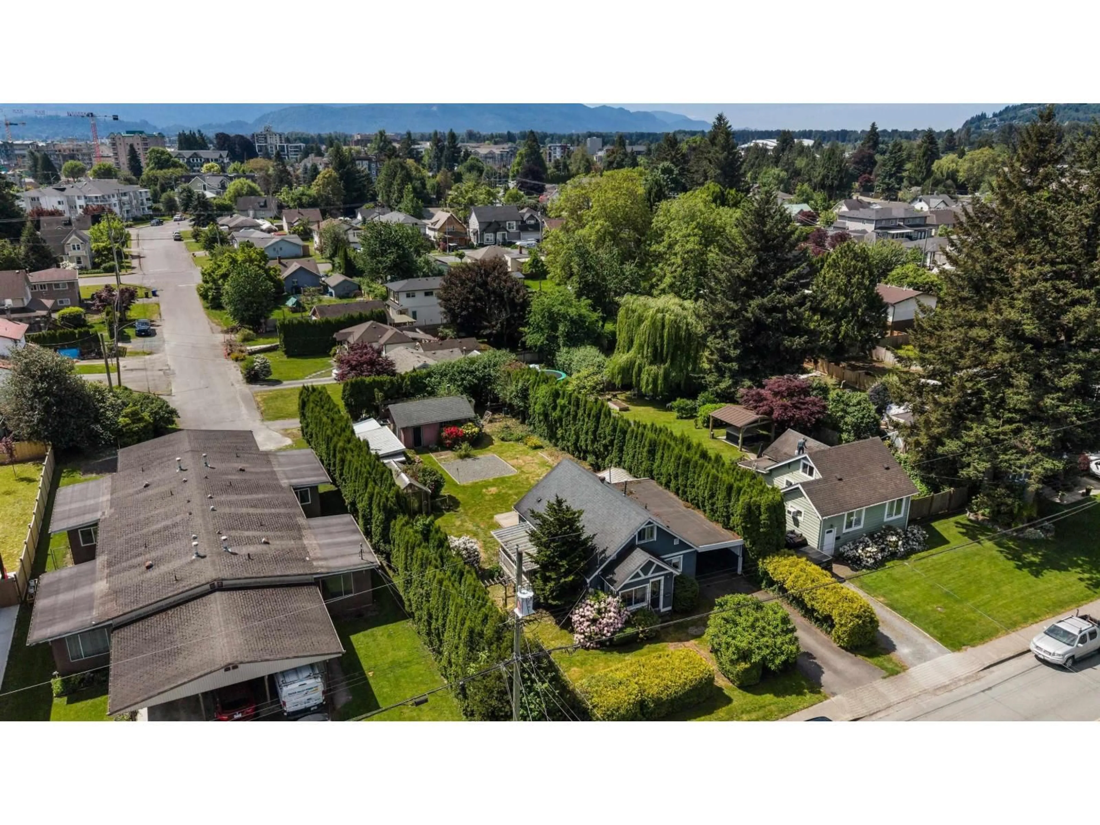 A pic from outside/outdoor area/front of a property/back of a property/a pic from drone, street for 45748 LEWIS AVENUE, Chilliwack British Columbia V2P3C4
