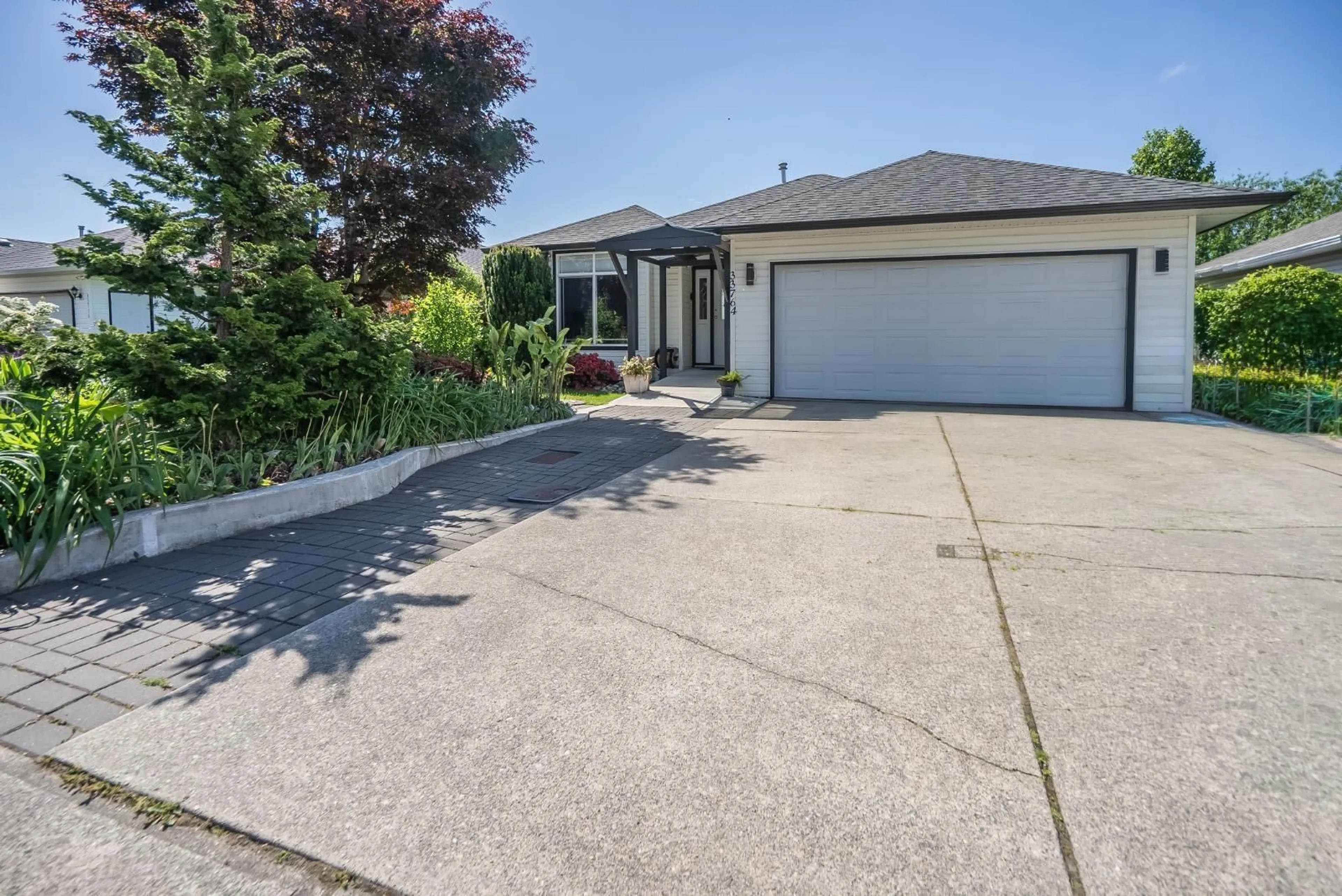 A pic from outside/outdoor area/front of a property/back of a property/a pic from drone, street for 33764 BLUEBERRY DRIVE, Mission British Columbia V2V7A1