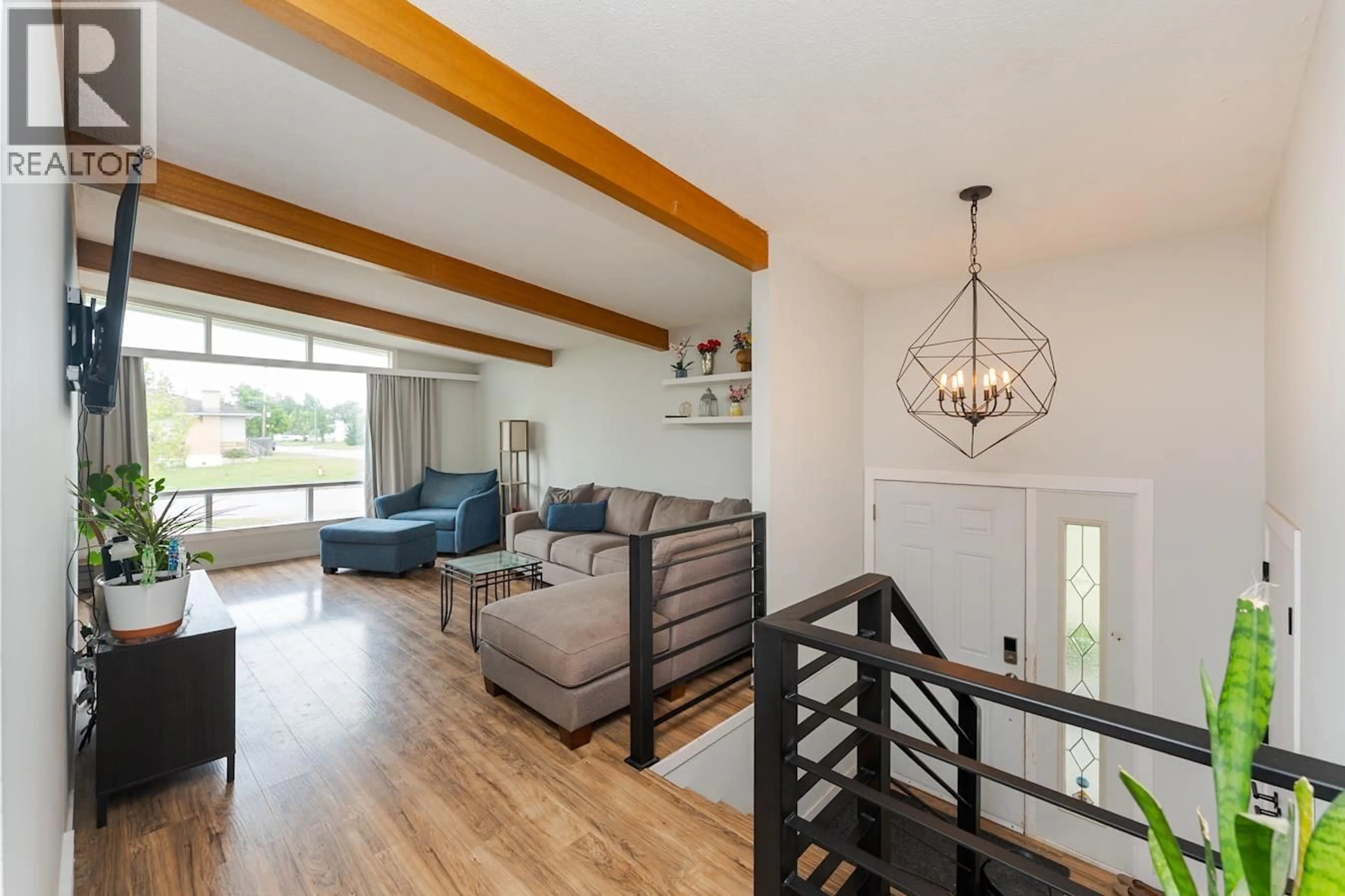 Living room with furniture, wood/laminate floor for 207 OGILVIE STREET, Prince George British Columbia V2M3H7