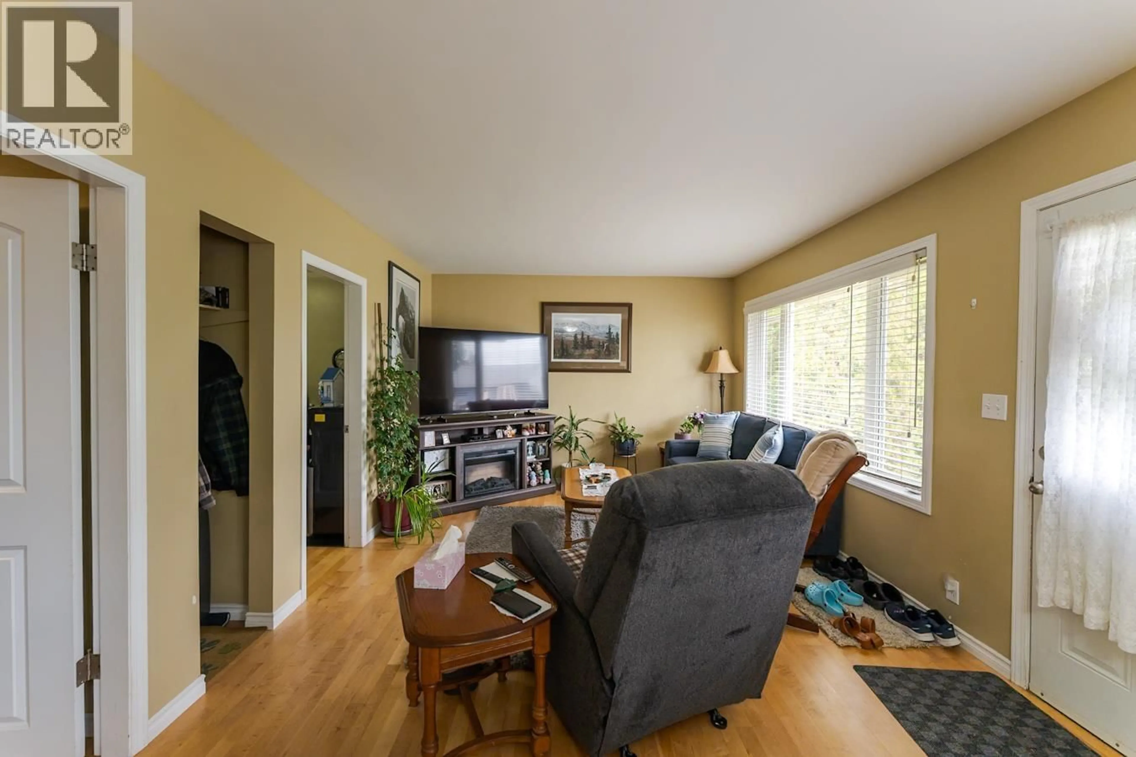 Living room with furniture, wood/laminate floor for 1321 DOUGLAS STREET, Prince George British Columbia V2M2N1