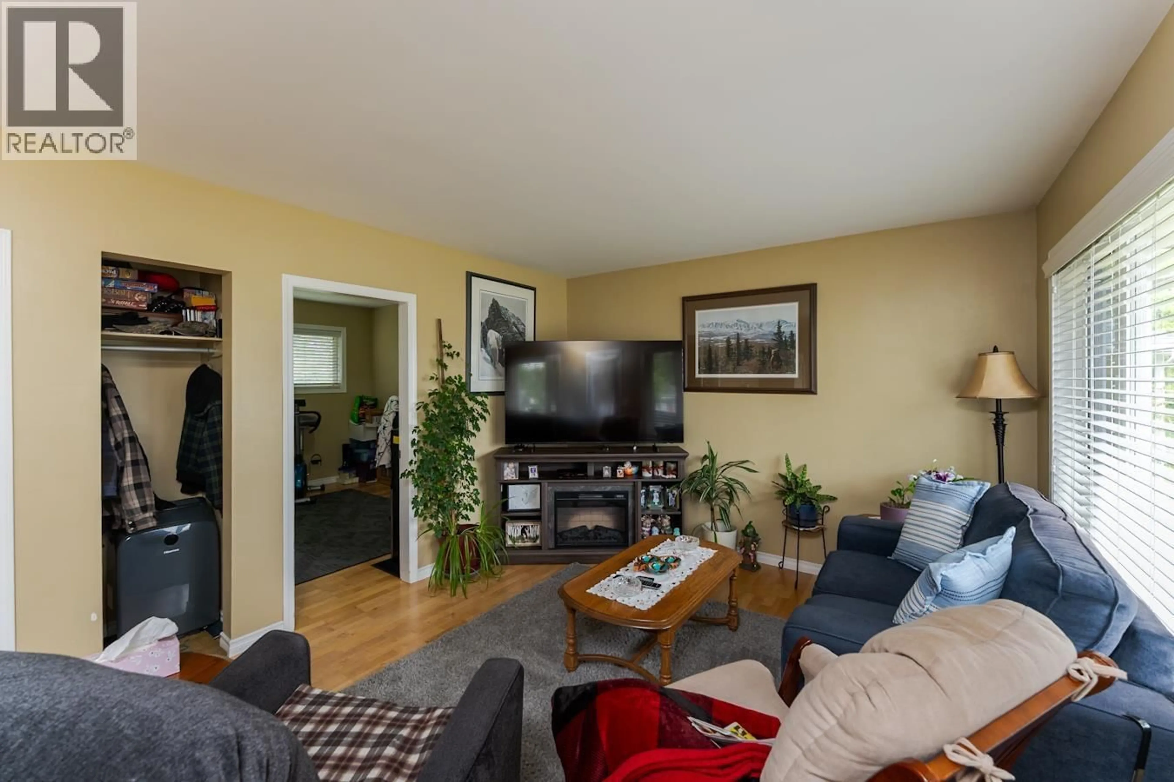 Living room with furniture, wood/laminate floor for 1321 DOUGLAS STREET, Prince George British Columbia V2M2N1