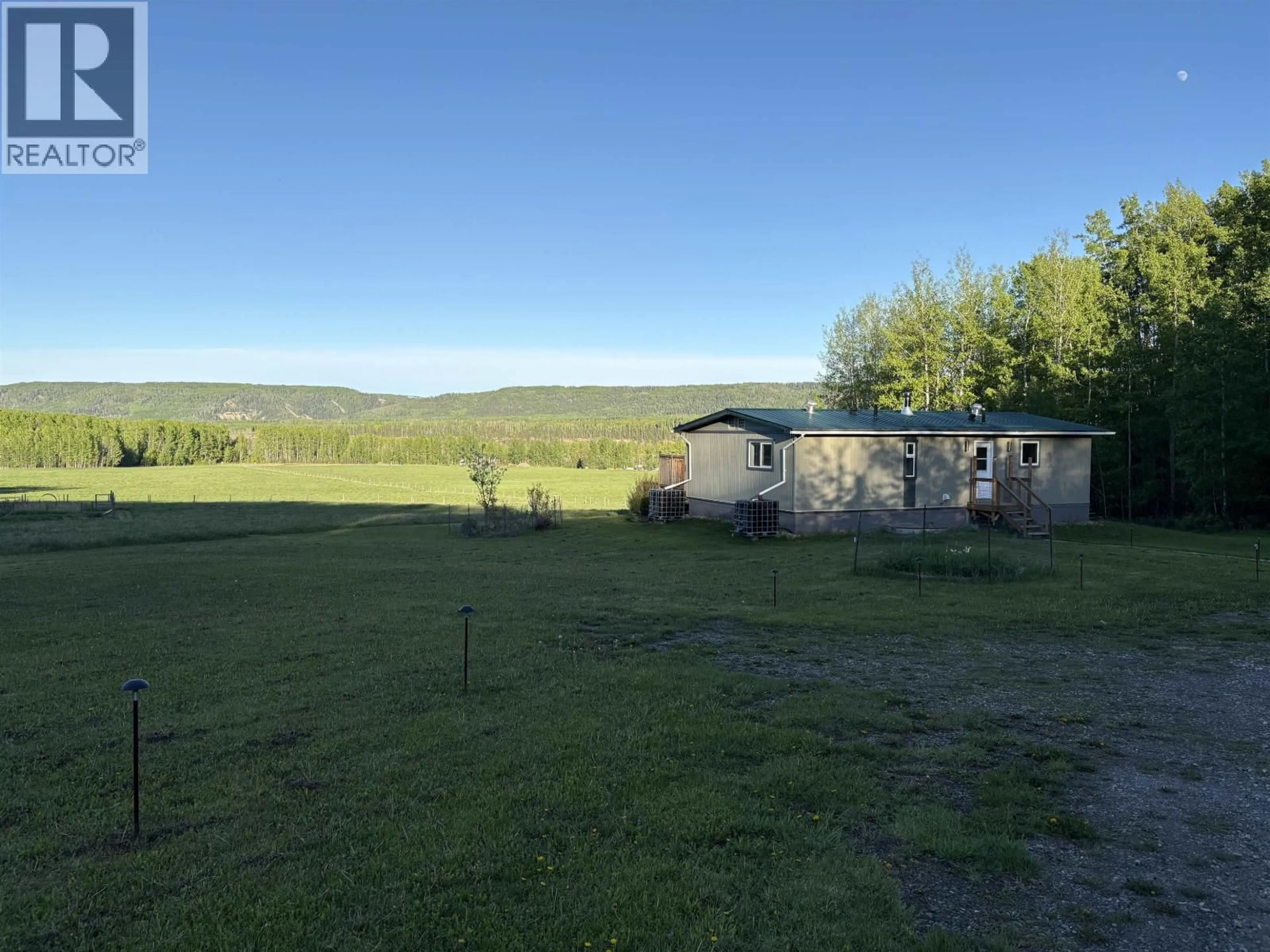 A pic from outside/outdoor area/front of a property/back of a property/a pic from drone, mountain view for 20154 BEATTIE DRIVE, Hudsons Hope British Columbia V0C1V0