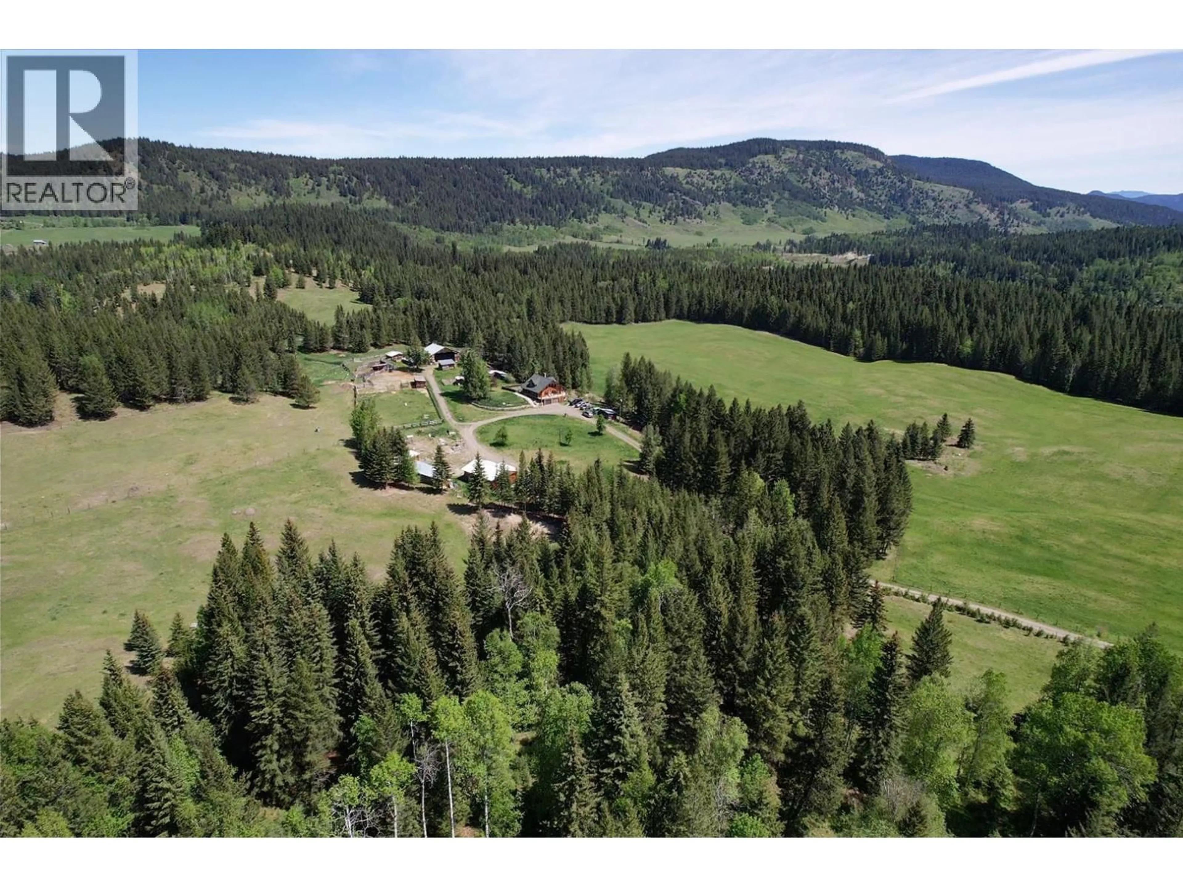 A pic from outside/outdoor area/front of a property/back of a property/a pic from drone, forest/trees view for 4485 TRIP ROAD, 100 Mile House British Columbia V0K1M0