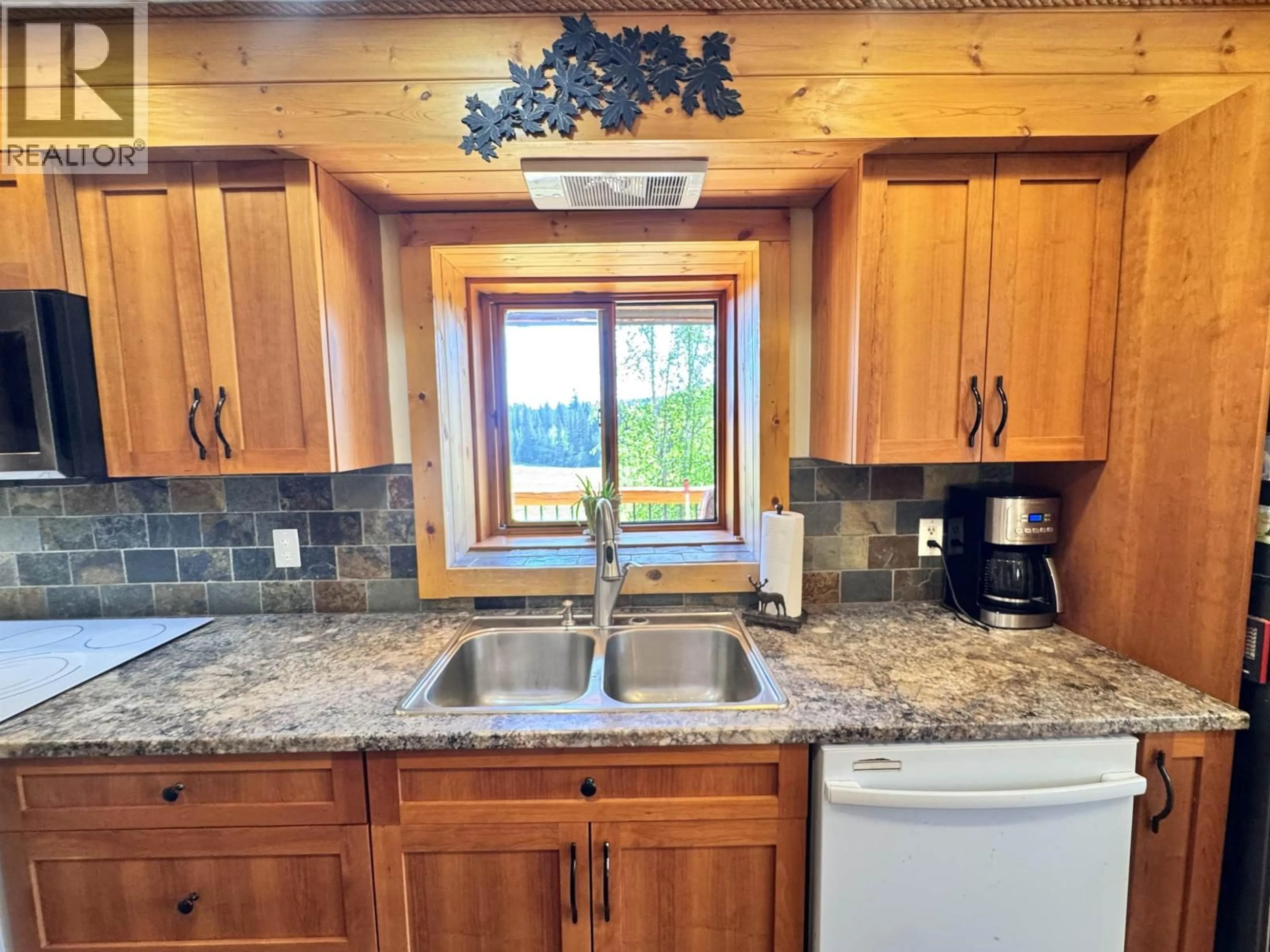 Standard kitchen, ceramic/tile floor for 4485 TRIP ROAD, 100 Mile House British Columbia V0K1M0